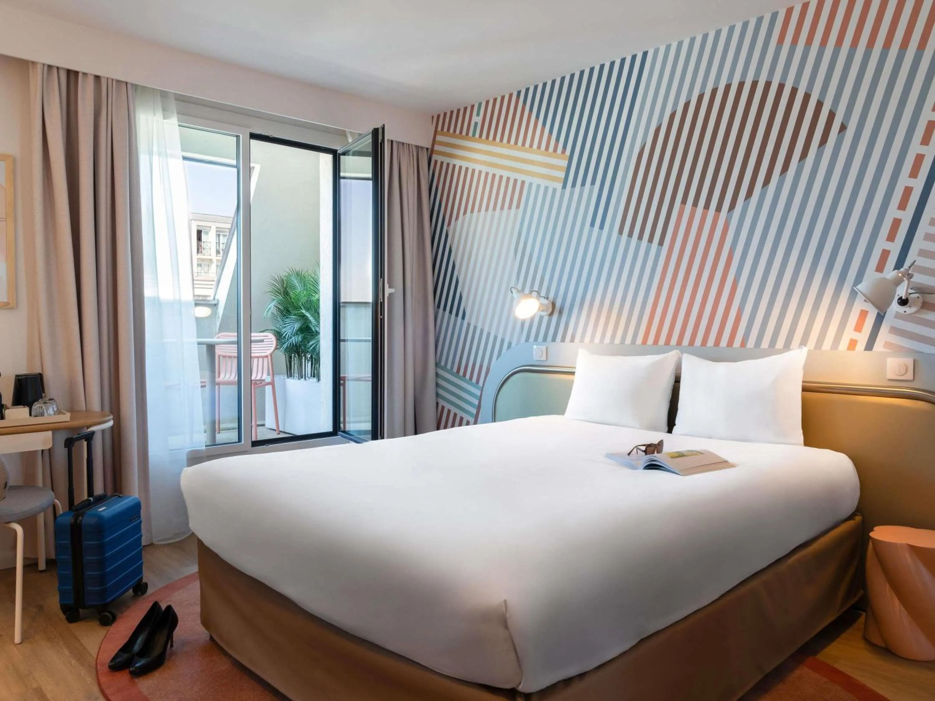 Junior Queen Suite with a Double Sofa Bed and Balcony - single occupancy in ibis Styles Paris Porte d'Orléans