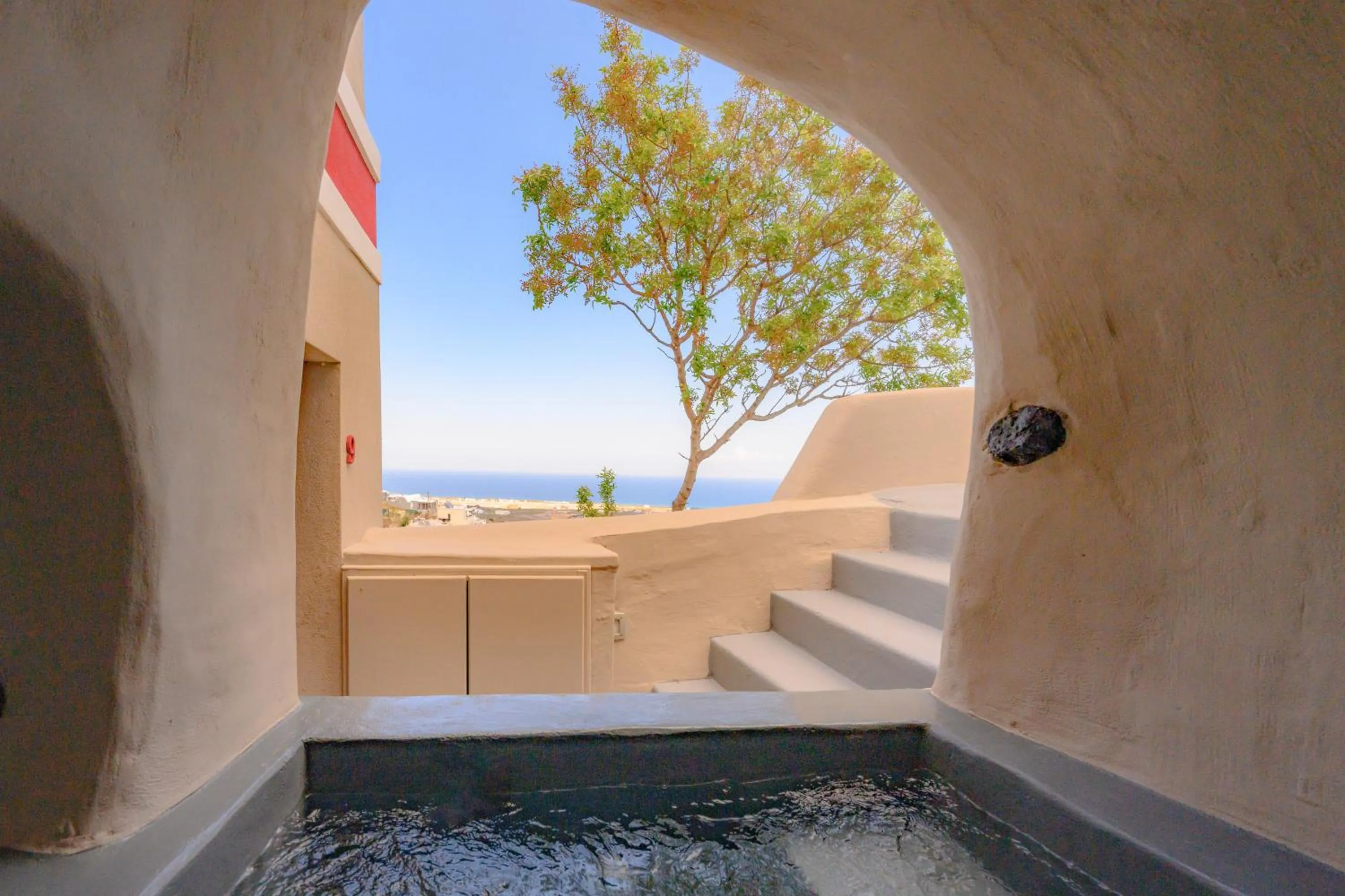 Exclusive suite with outdoor cave jetted hot tub in Nano Suites