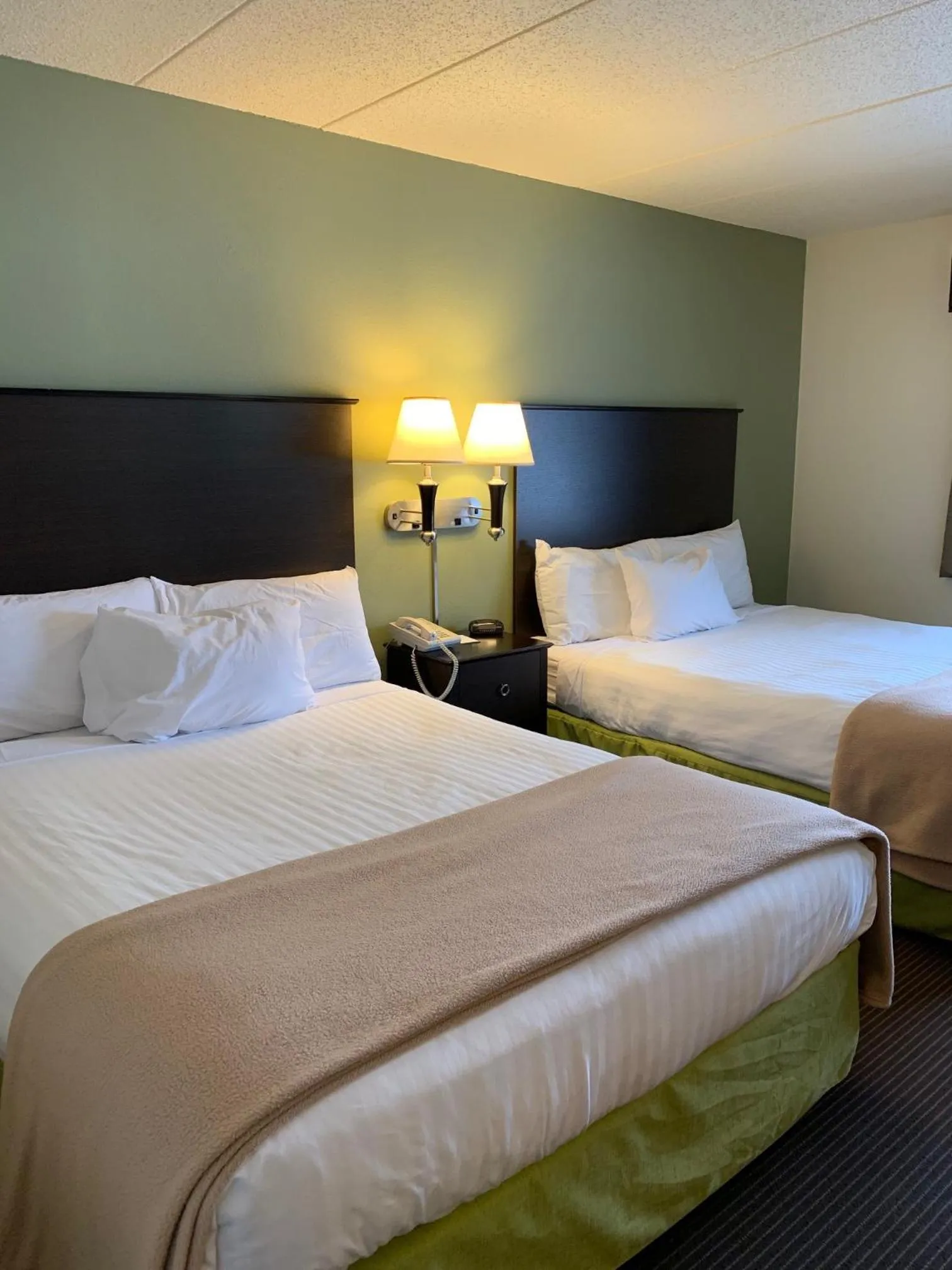 Queen Room with Two Queen Beds - Non-Smoking in AmericInn by Wyndham Hampton