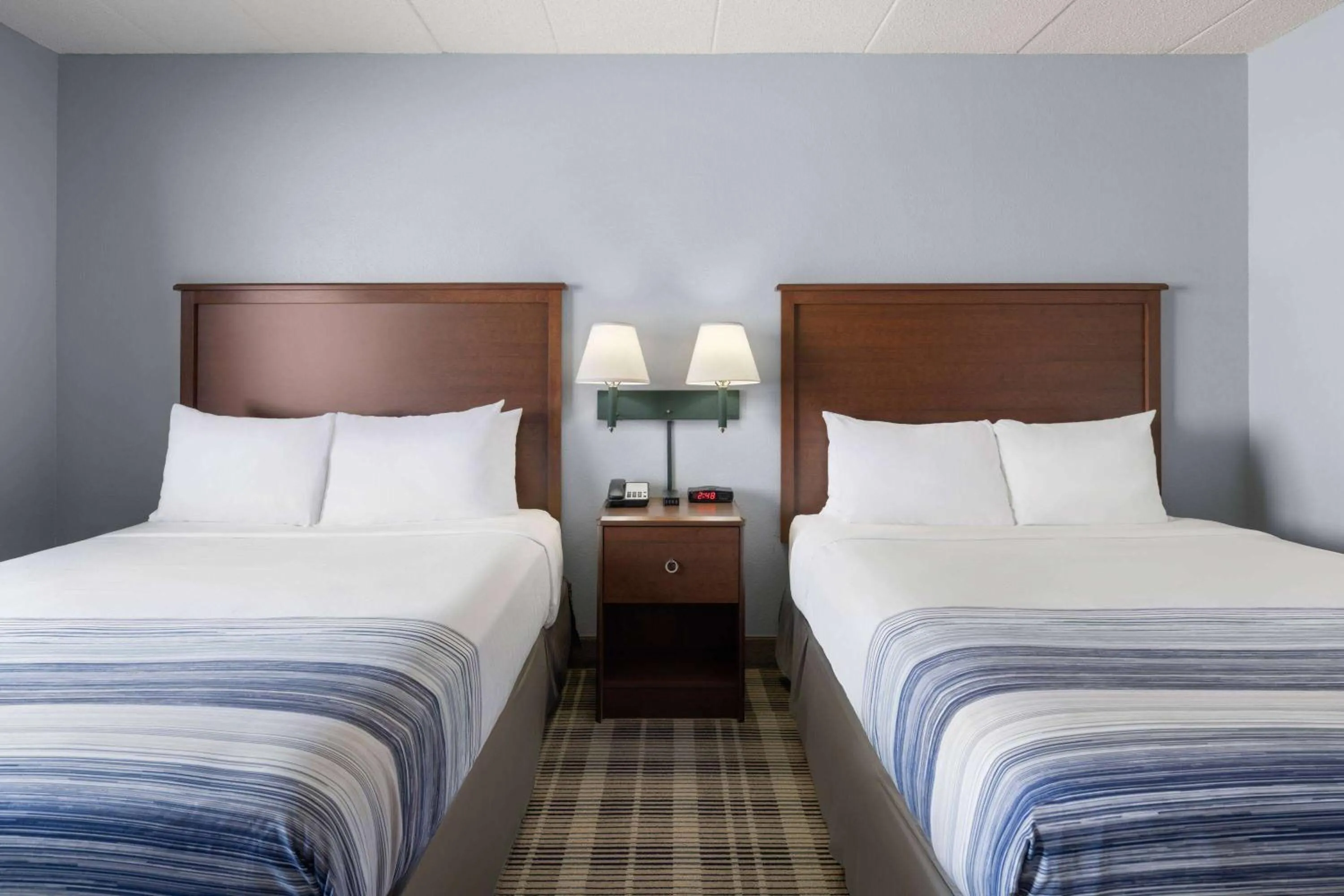 Deluxe Queen Room with Two Queen Beds - Non-Smoking in AmericInn by Wyndham Stuart