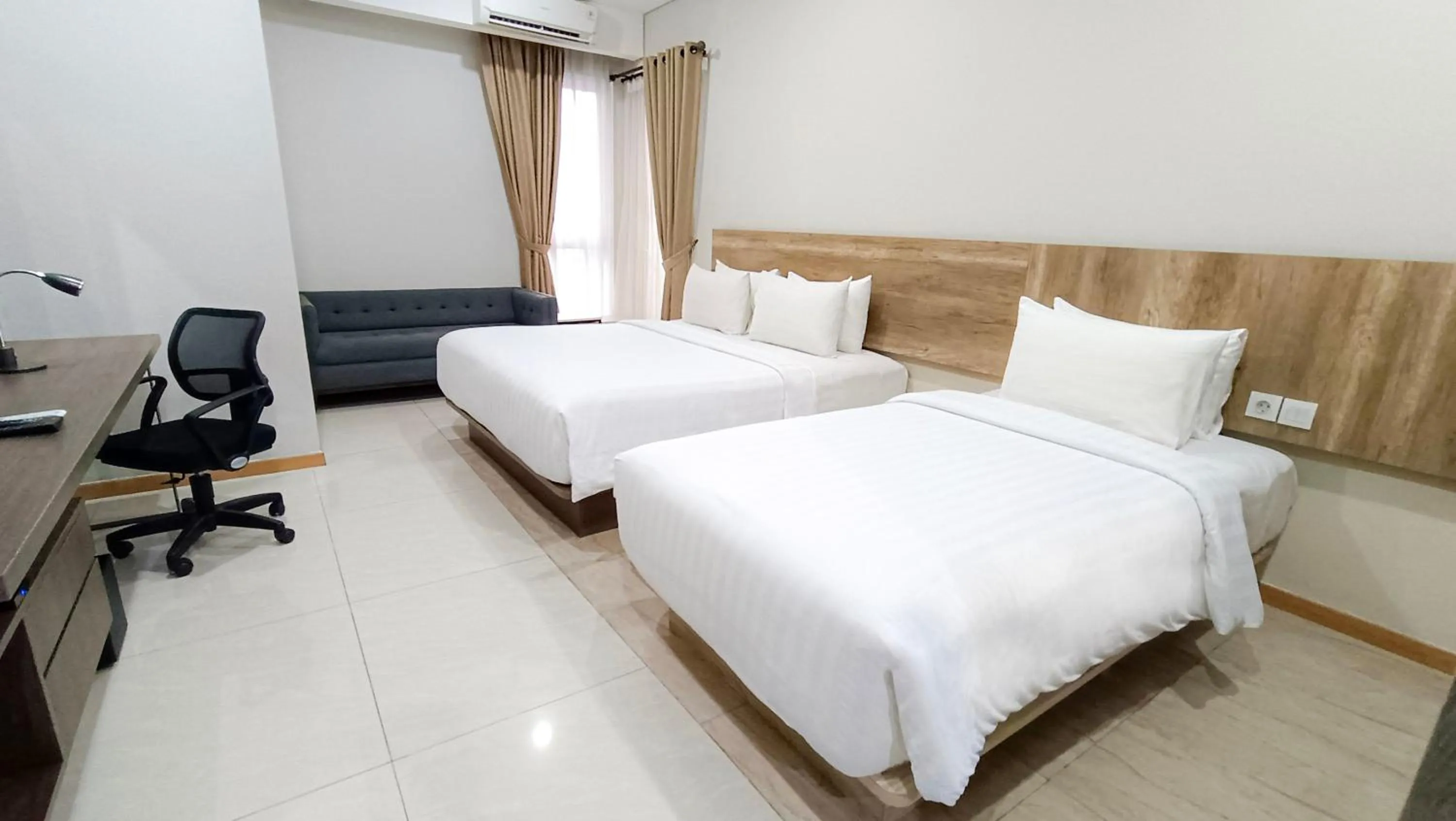 Deluxe Triple Room in Grande Valore Hotel Cikarang