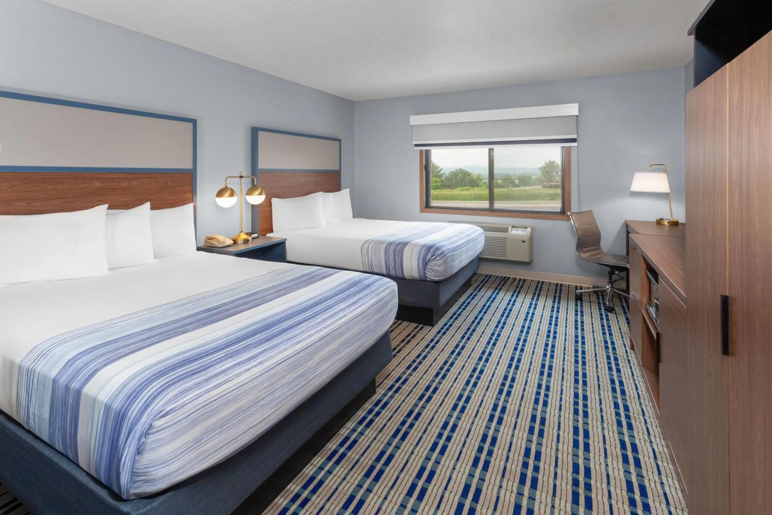 Queen Room with Two Queen Beds - Non-Smoking in AmericInn by Wyndham West Salem