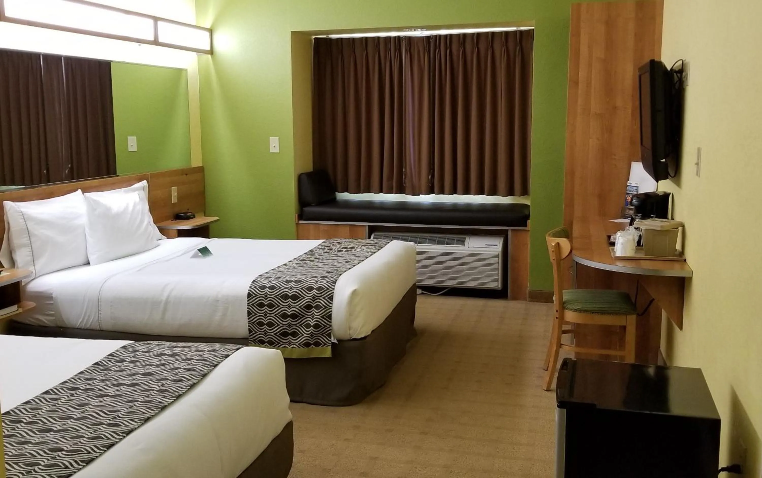 Deluxe Queen Room with Two Queen Beds and Bathtub with Grab Bars - Mobility Accessible/Non-Smoking in Microtel Inn & Suites by Wyndham Delphos