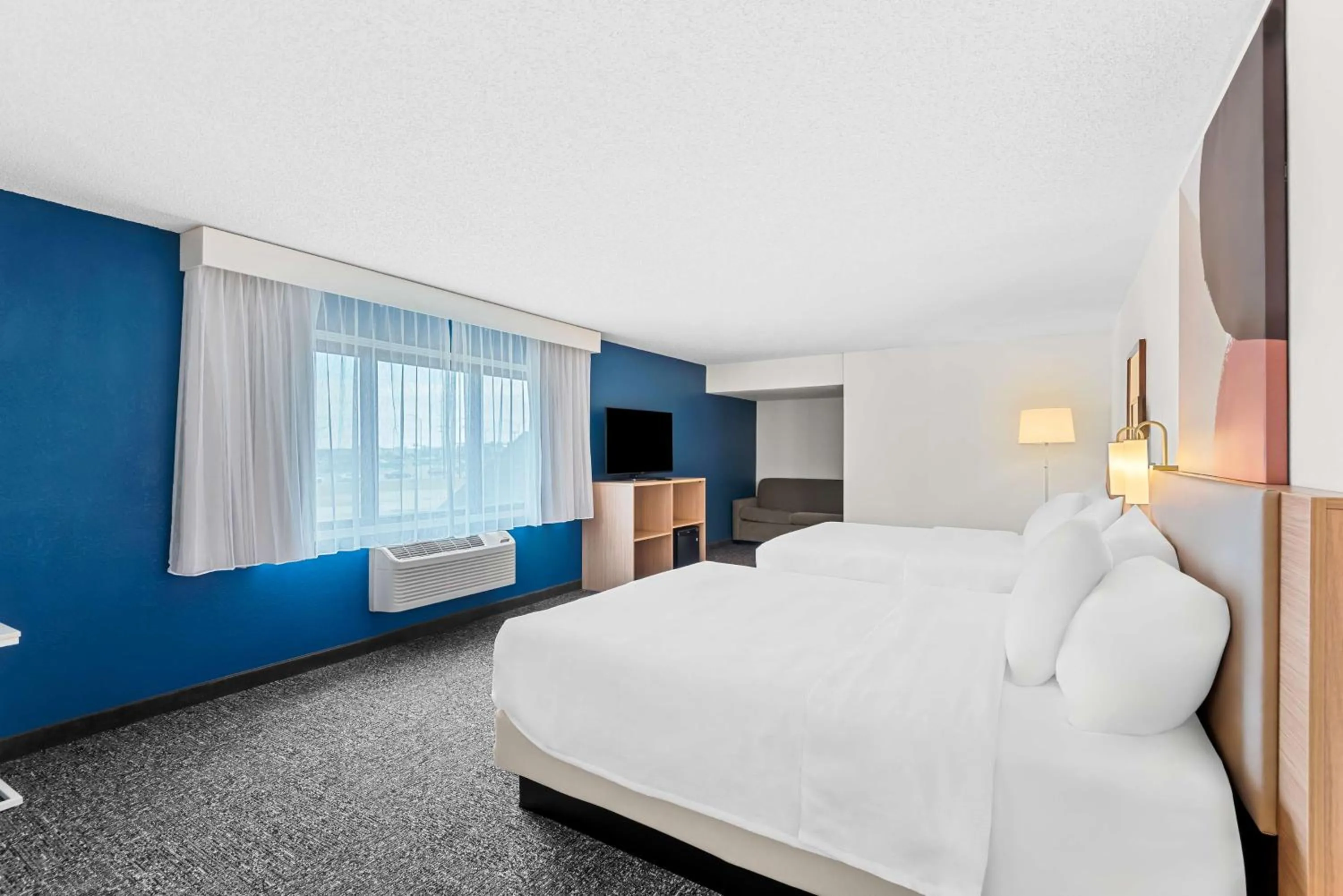 Queen Room with Two Queen Beds and Sofa Bed in Spark by Hilton Cedar Falls