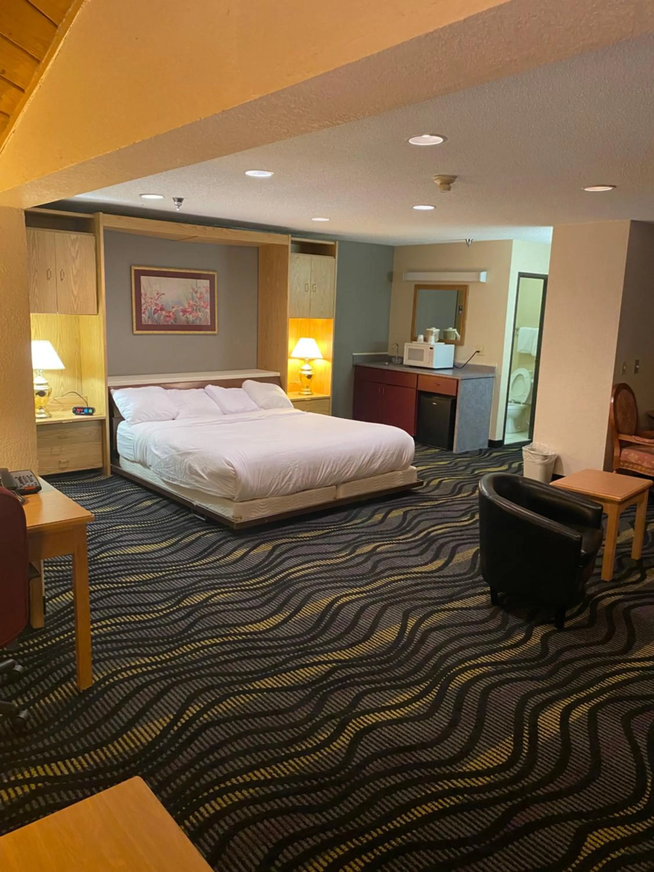 King Suite with Jetted Tub - Non-Smoking in Baymont by Wyndham Logan