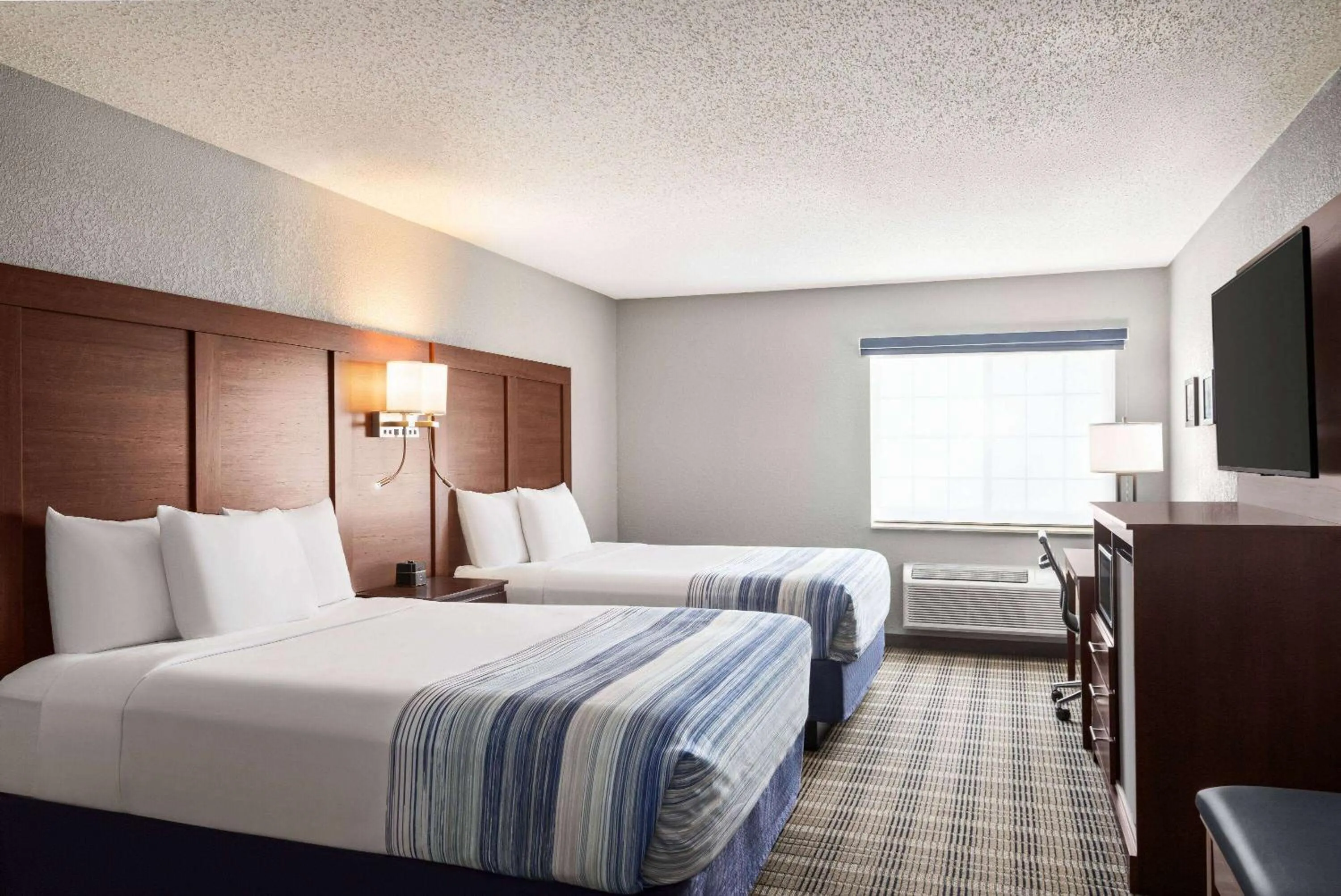 Queen Room with Two Queen Beds - Non-Smoking in AmericInn by Wyndham Williamsburg