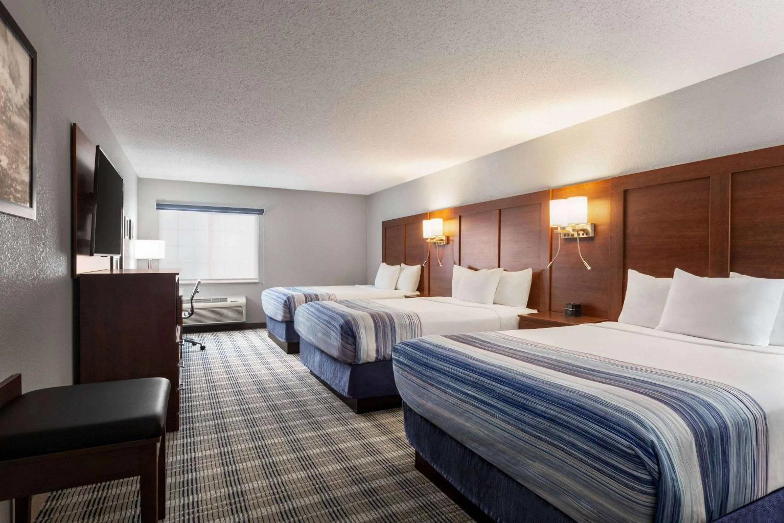 Queen Room with Three Queen Beds - Non-Smoking in AmericInn by Wyndham Williamsburg