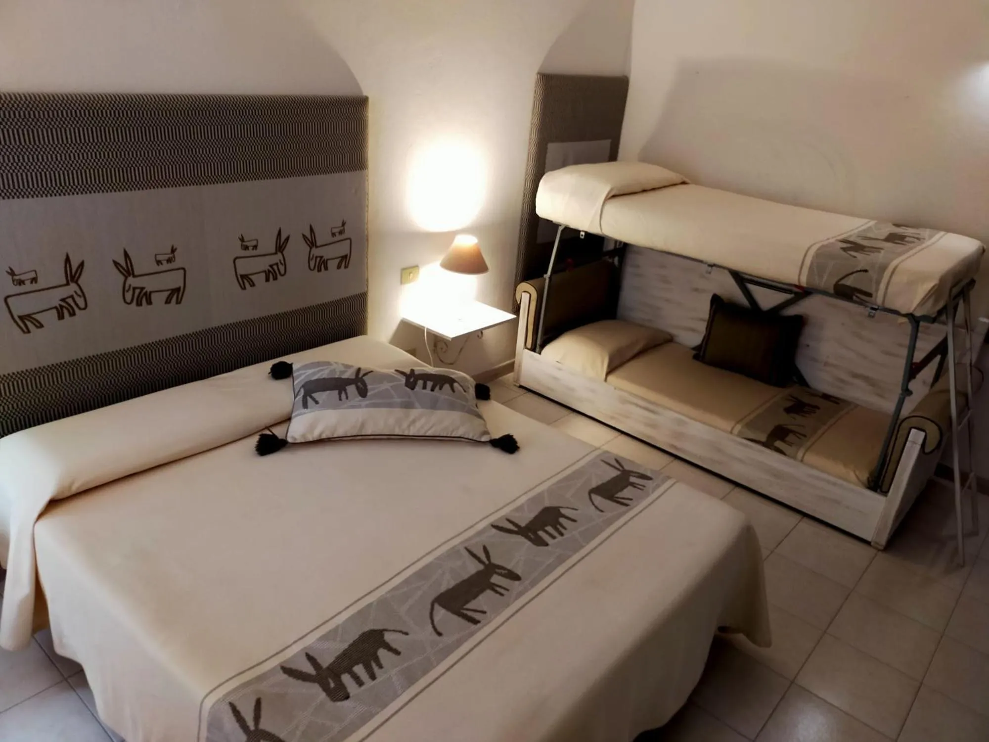 Comfort Quadruple Room - single occupancy in Hotel Canne al Vento