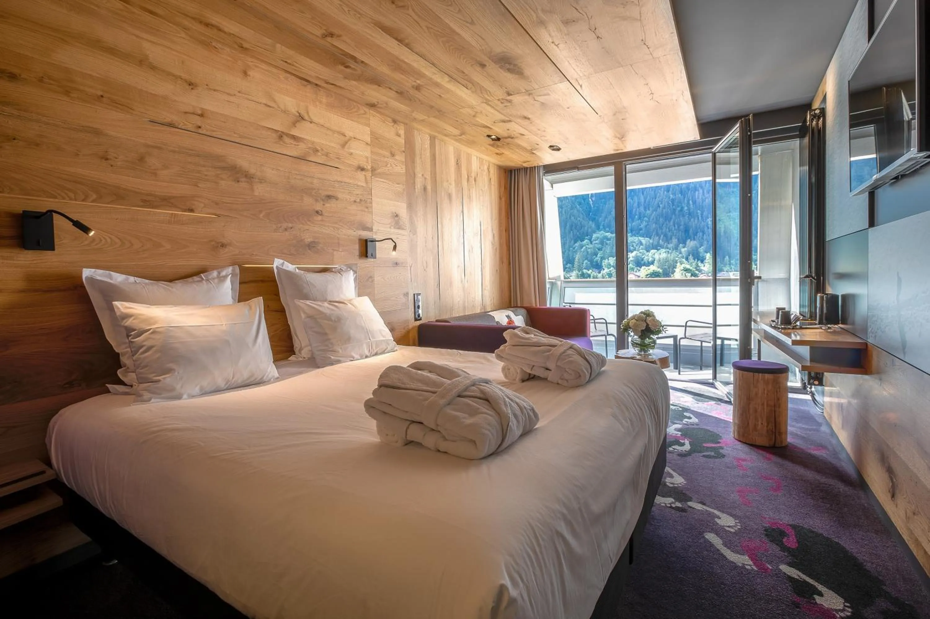 Superior Room with sofa and balcony – Mont-Blanc Range view in Alpina Eclectic Hotel