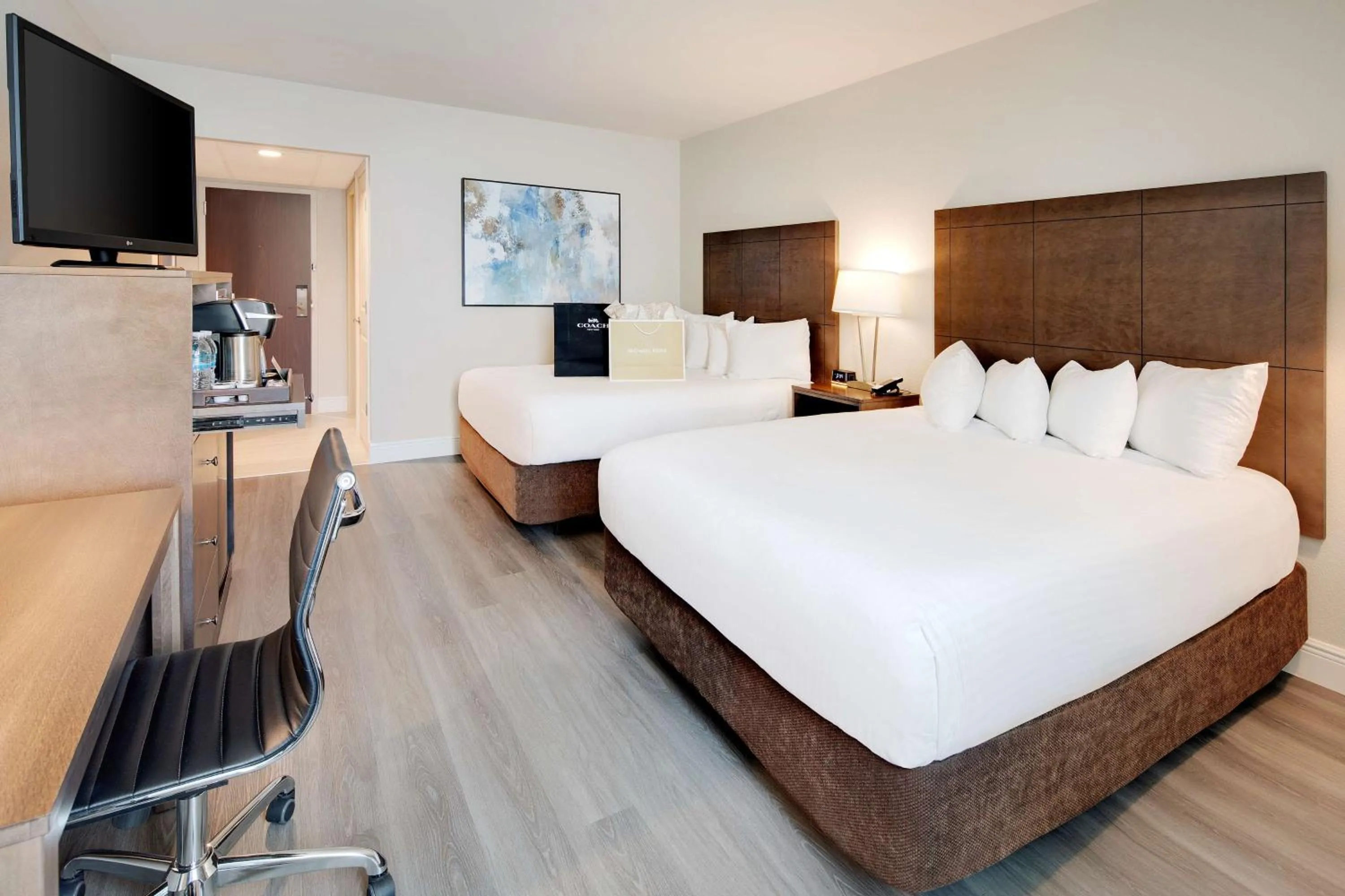 Queen Room with Two Queen Beds and Mobility Accessible Tub - City View in The Florida Hotel & Conference Center in the Florida Mall