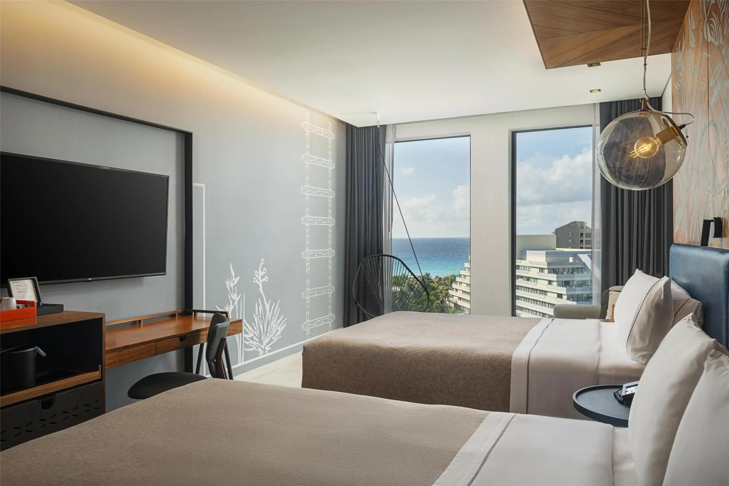 Premium Queen Room with Two Queen Beds and Sunset Bay View in Canopy By Hilton Cancun La Isla
