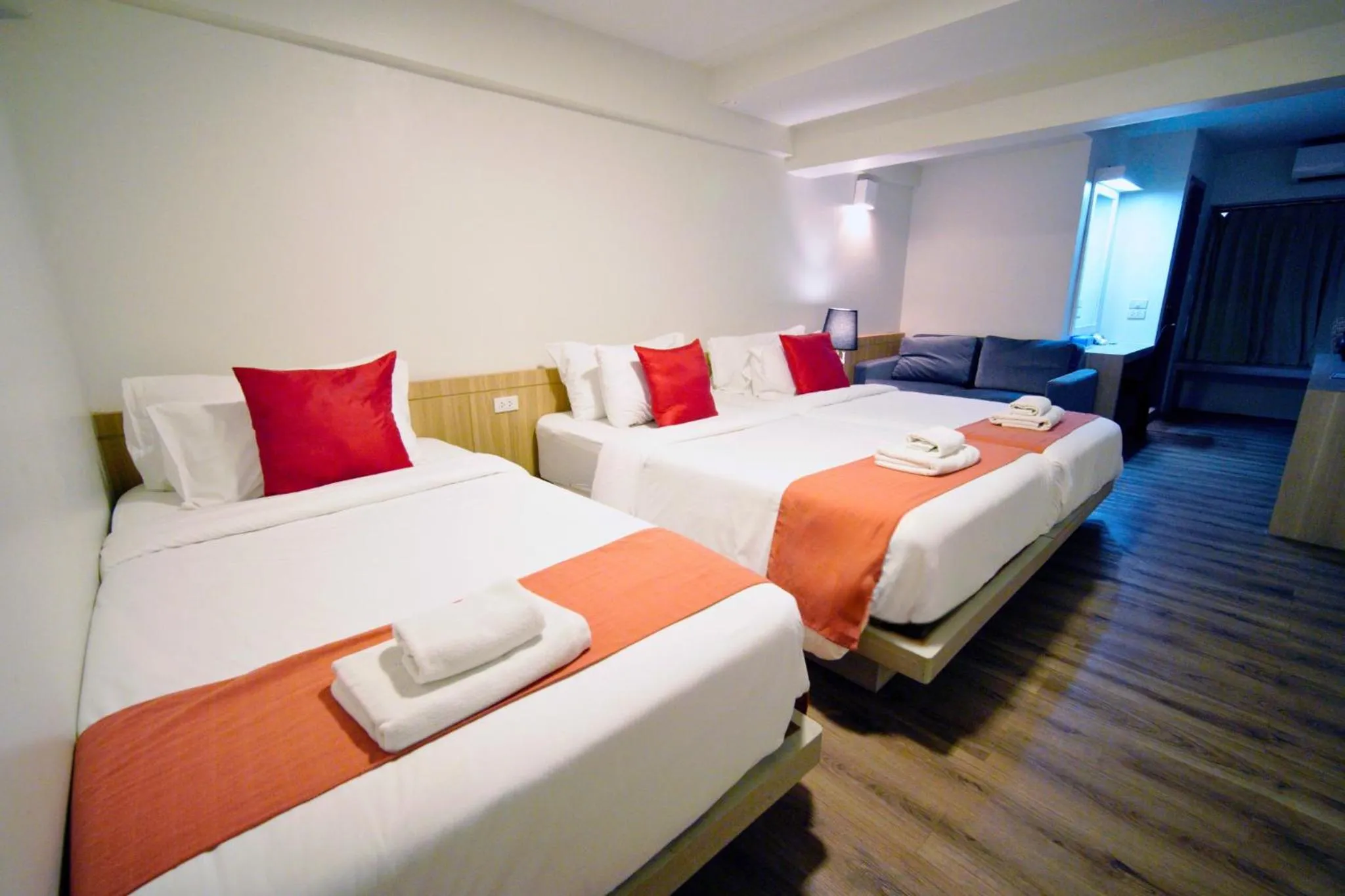 Deluxe Triple Room with Window in Wild Orchid Villa Bangkok