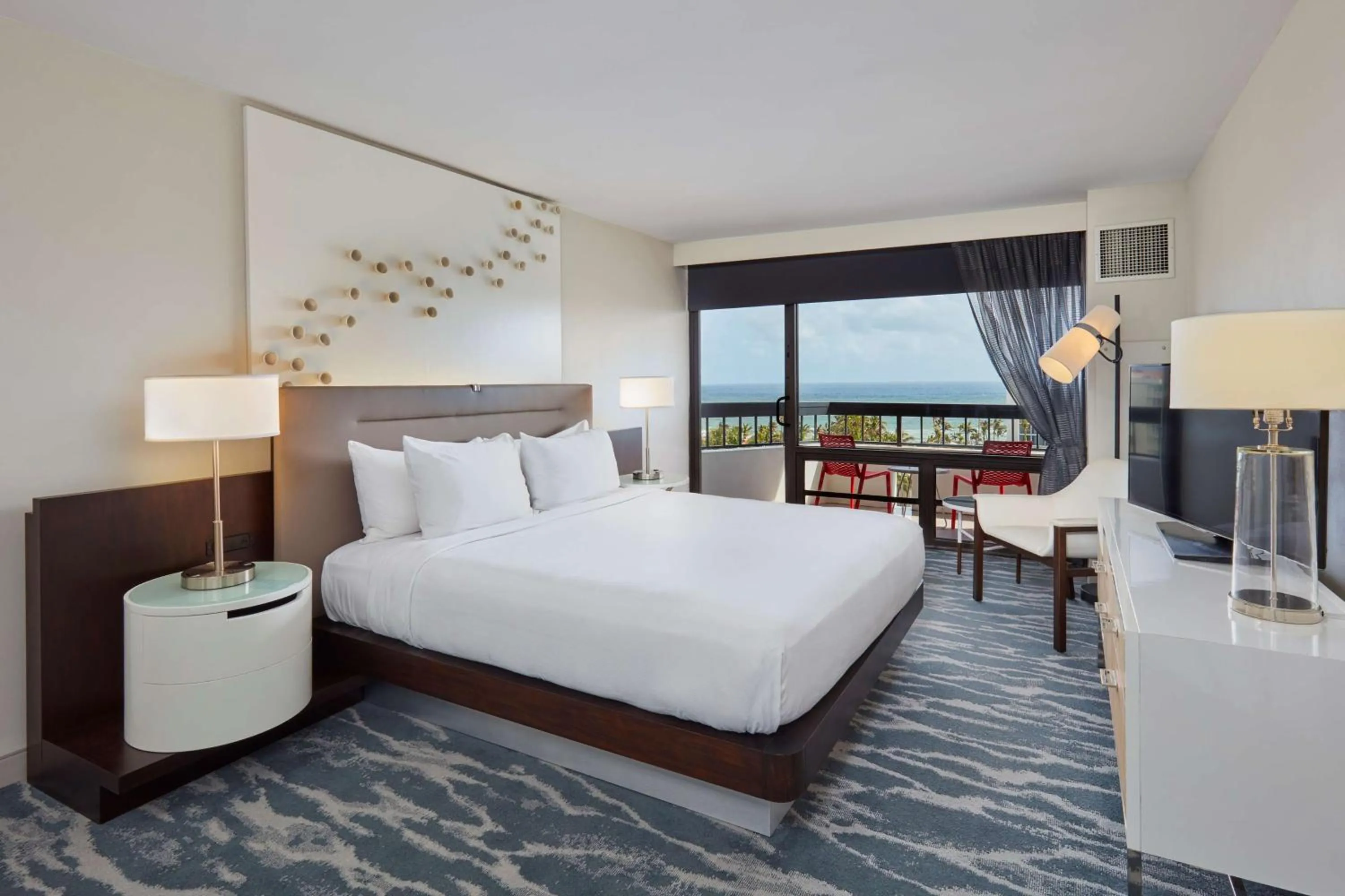 King Room with Balcony and Partial Ocean View in Waterstone Resort & Marina Boca Raton, Curio Collection by Hilton