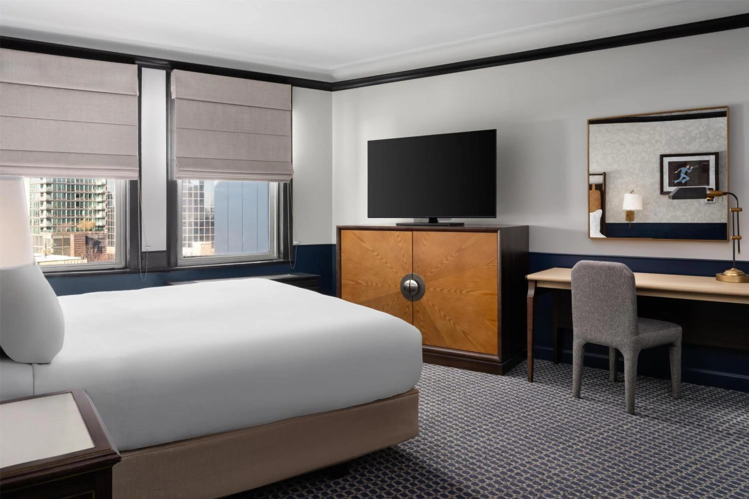 Corner King Room with One King Bed and Chair in Hilton Orrington/Evanston