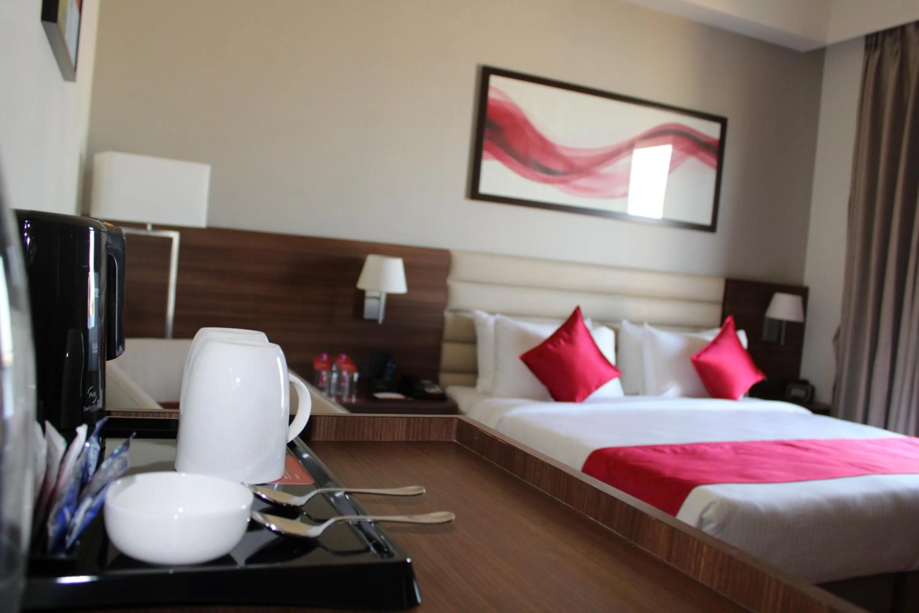 Deluxe King Room (Non-Smoking) - single occupancy - Book & Unlock Exclusive Discounts in Ramada by Wyndham Gandhidham Shinay