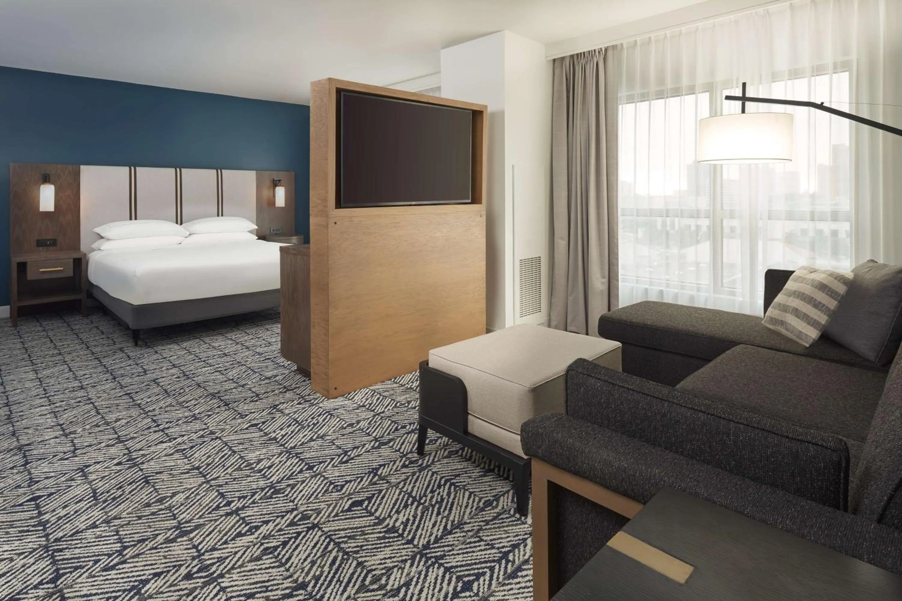 One-Bedroom King Suite with Mobility Accessible Tub in The Chifley Houston, Tapestry Collection by Hilton