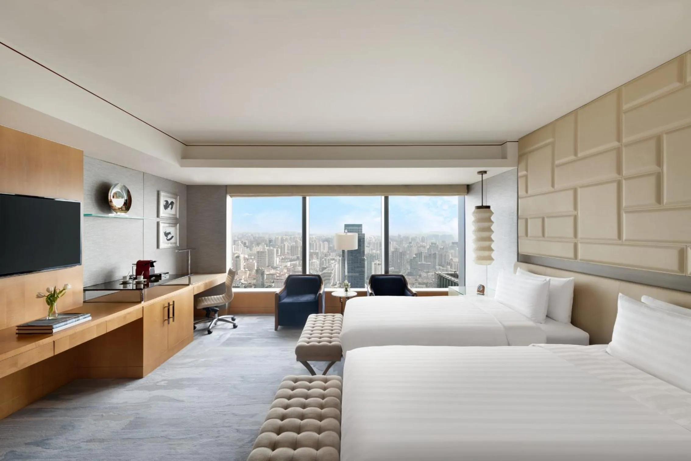 Premier Twin Room in Jing An Shangri-La, Shanghai - sits centrally amid Puxi's iconic landmarks, uniquely positioned nearby Jing'an Temple
