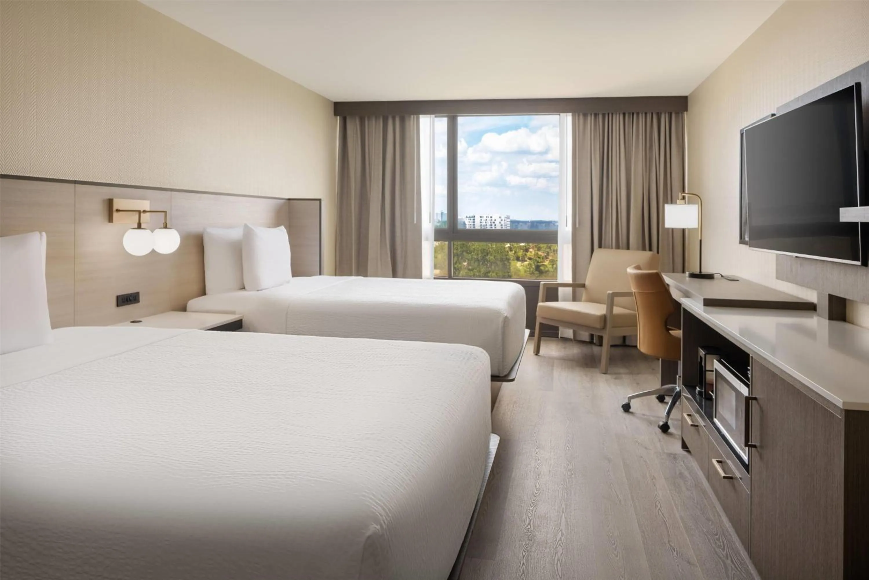 Deluxe Queen Room with Two Queen Beds and Lake View - High Floor Newly Renovated (NO RESORT FEE) in Ramada Plaza by Wyndham Orlando Resort & Suites Intl Drive - Newly Renovated!