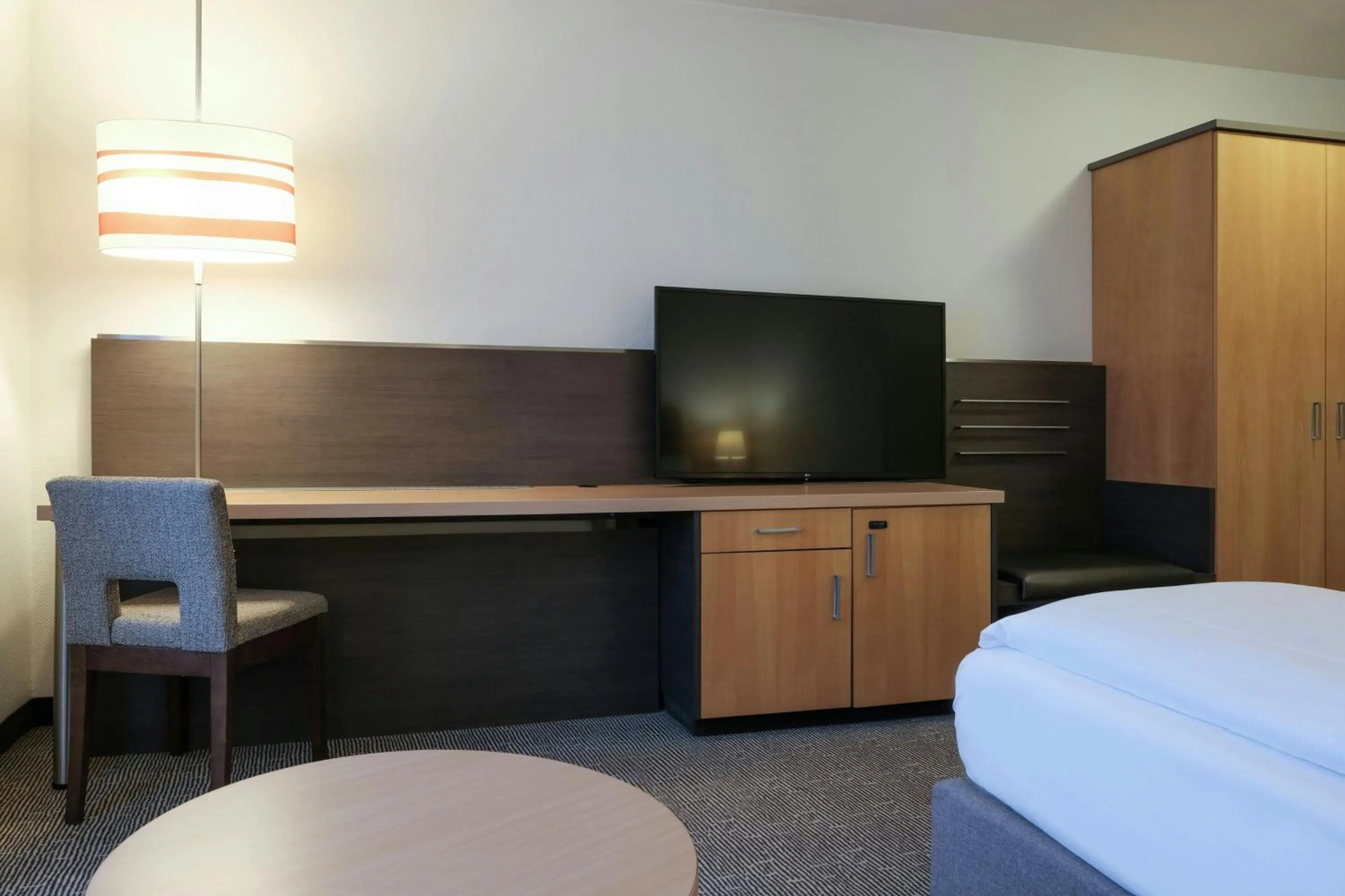 Photo of the whole room, Bed in FOUR Essen City Centre