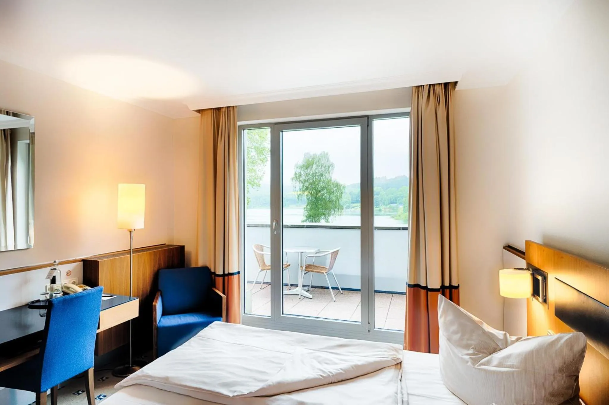 Deluxe Room with Balcony and Lake View in Welcome Hotel Meschede Hennesee