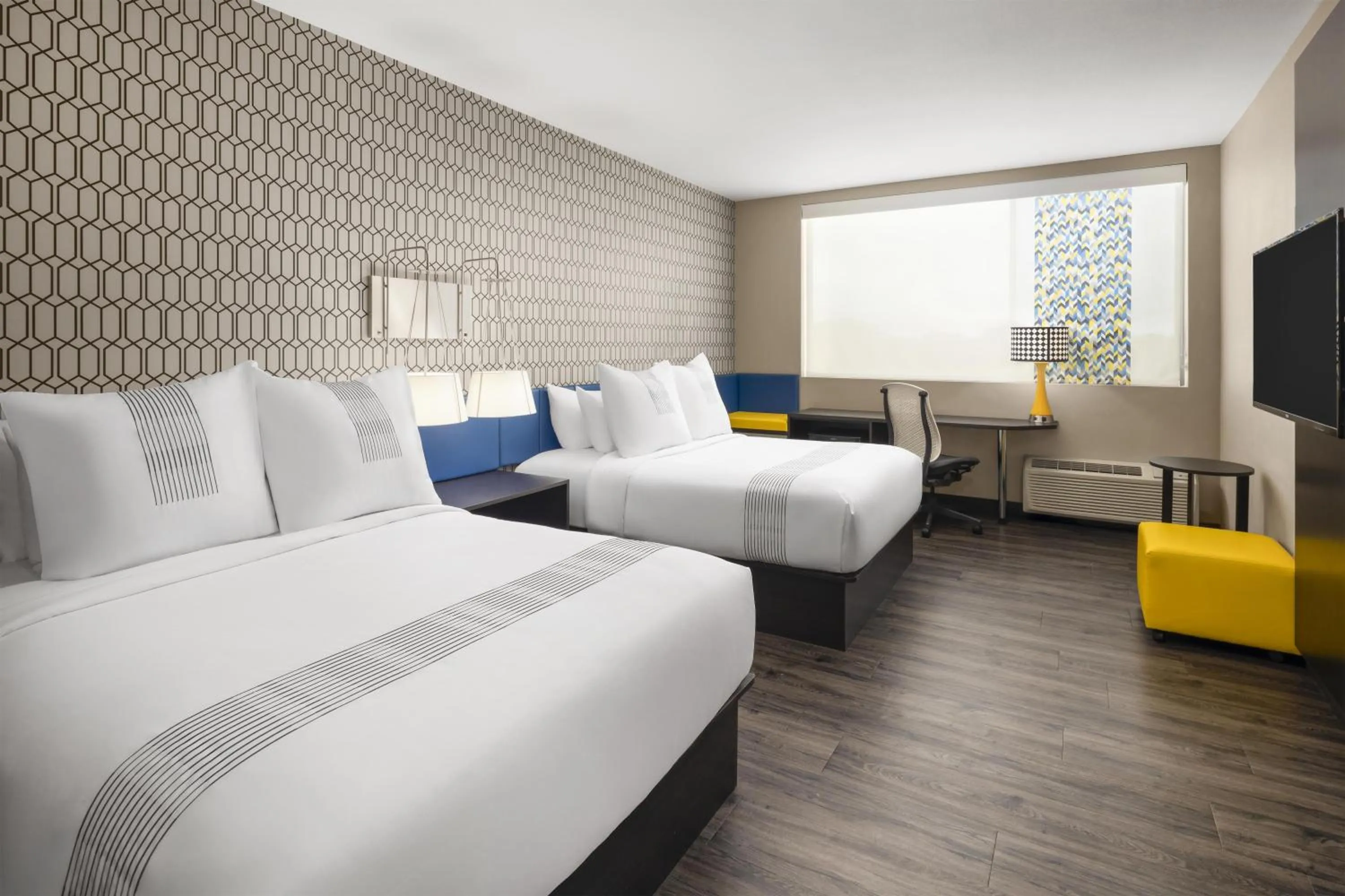 Queen Room with Two Queen Beds in GLō Best Western Dawley Farms In Sioux Falls