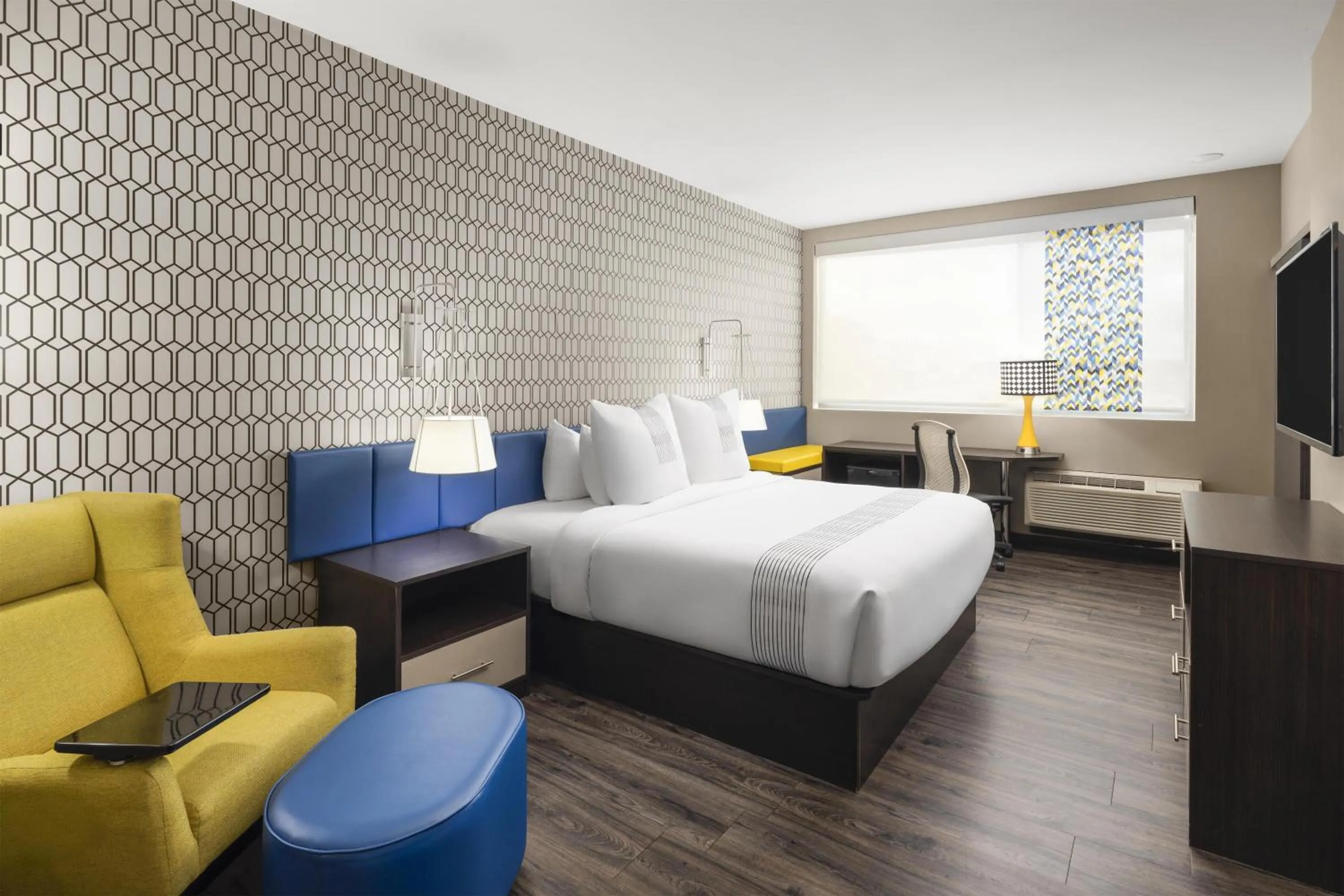 Larger King Room with Mobility Accessible Roll-In Shower in GLō Best Western Dawley Farms In Sioux Falls