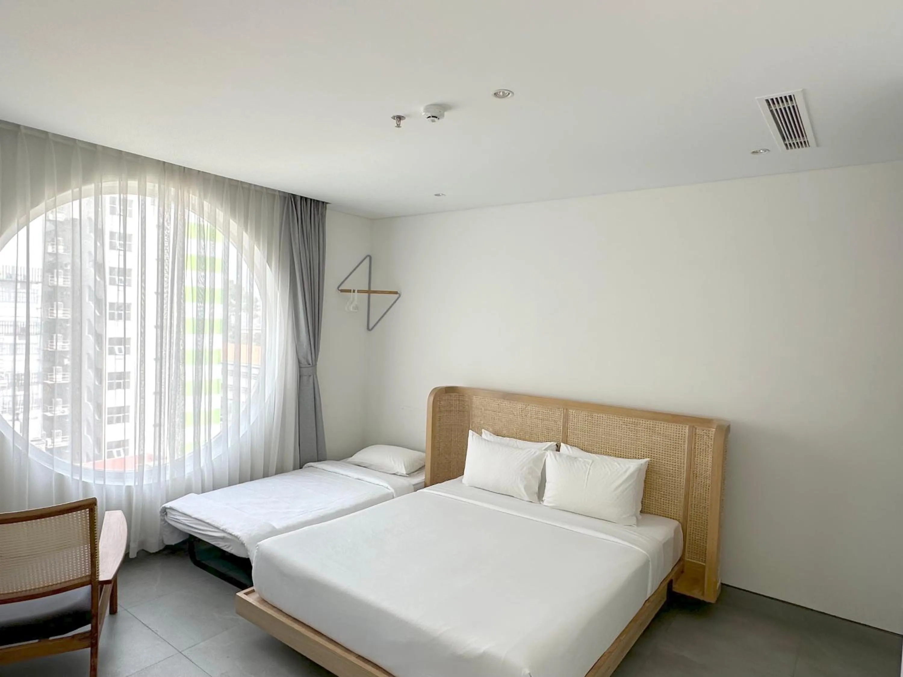 Triple Room with City View in MEANDER Saigon