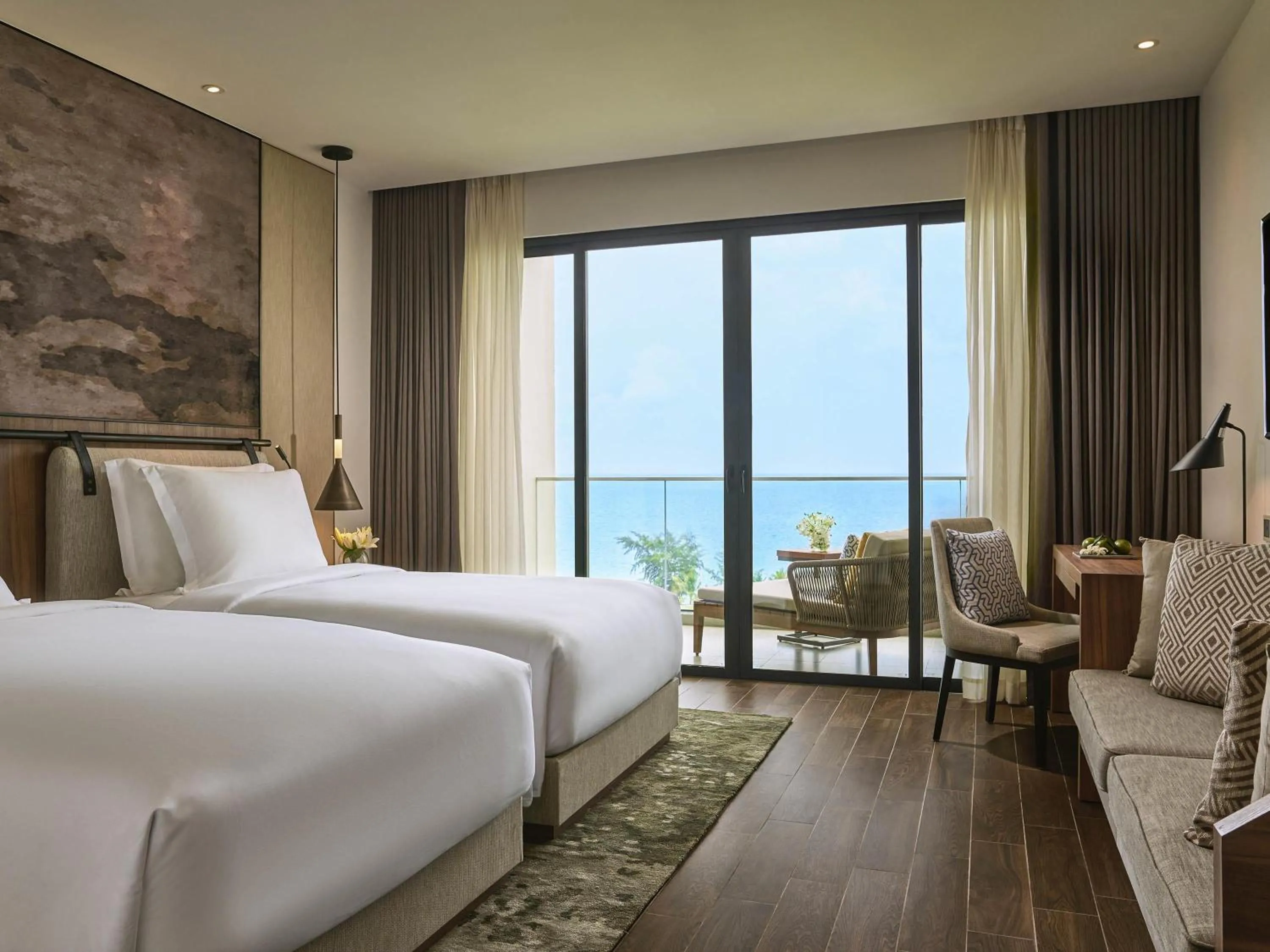Superior Twin Room with Balcony and Sea View in Mövenpick Resort Waverly Phu Quoc