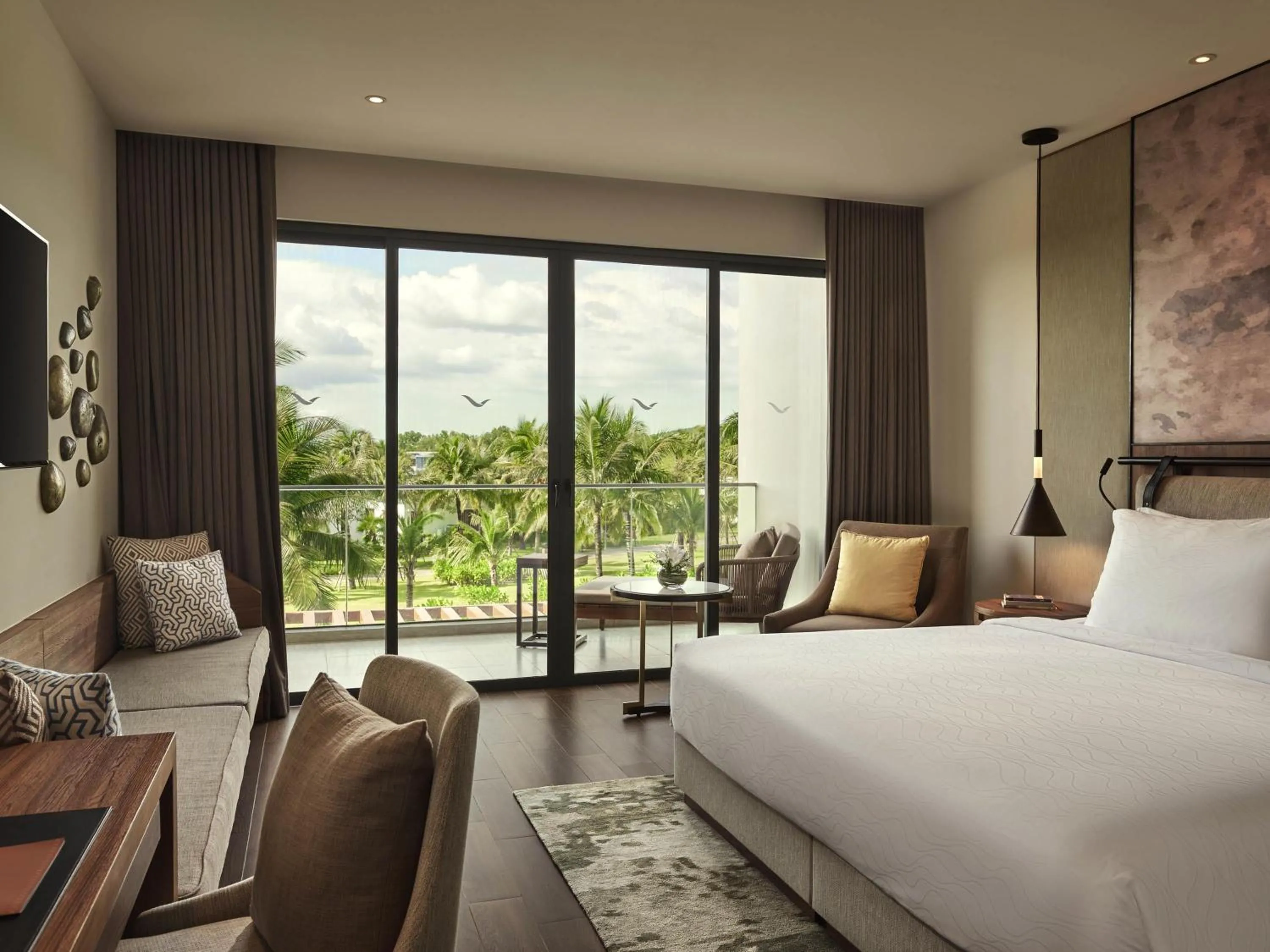 Superior King Room with Balcony and Garden View in Mövenpick Resort Waverly Phu Quoc