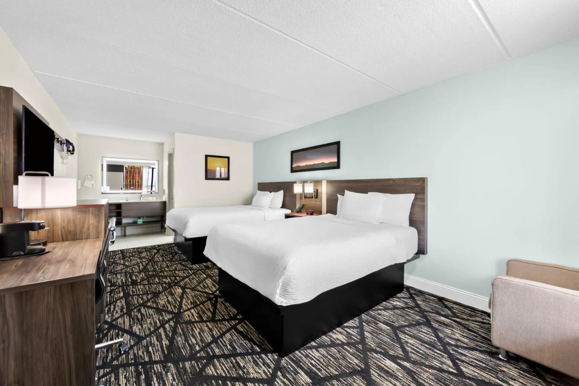 Quadruple Room with Two Queen Beds and Roll-In Shower - Disability Access/Non Smoking/Exterior Hall in Days Inn & Suites by Wyndham Pigeon Forge