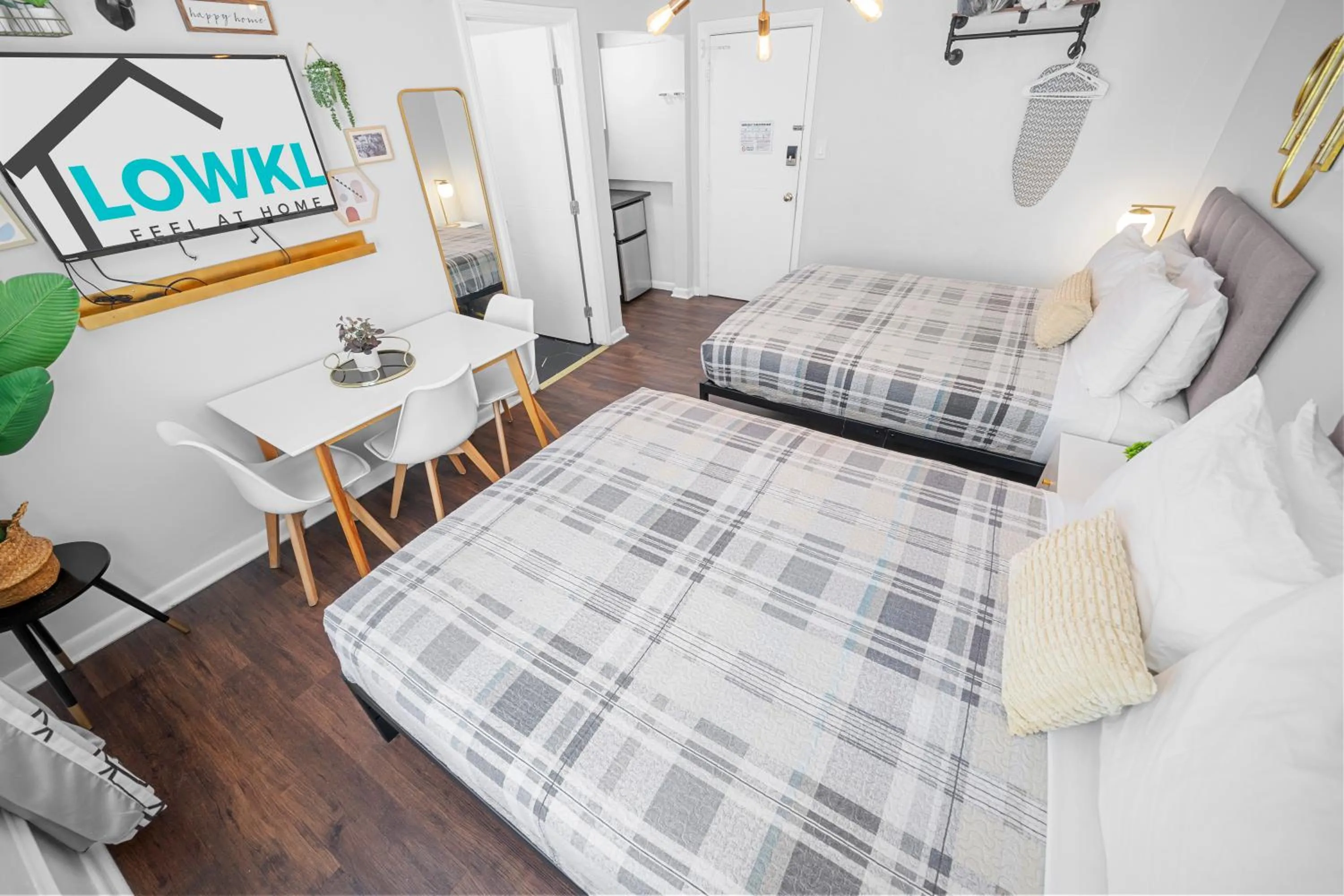 Deluxe Two Queen Beds Studio with Kitchenette in Nine20 Collins Apartments by Lowkl