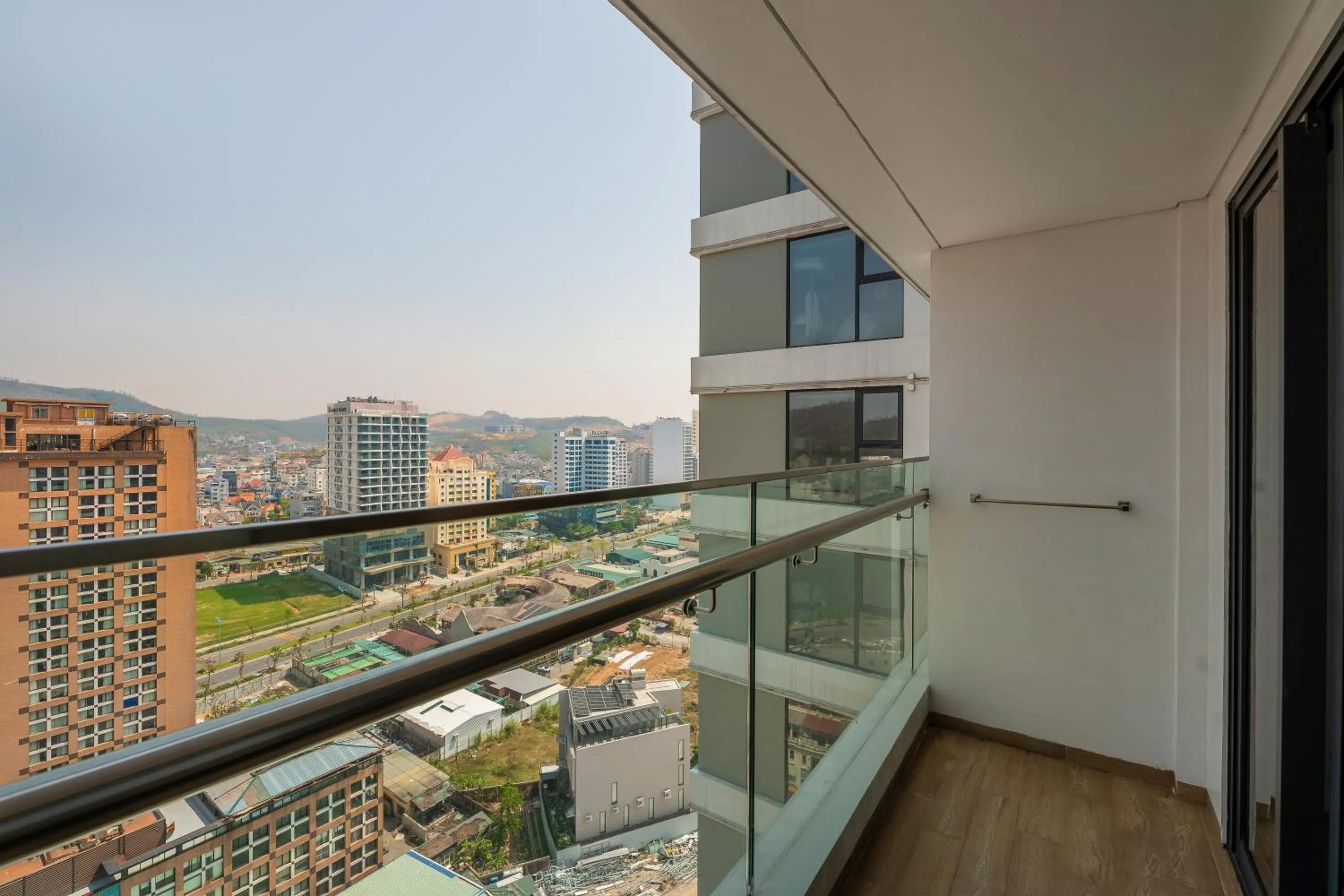 Deluxe City View King Bed With Balcony in DeLaSea Ha Long Hotel - Modern Bayview Escape