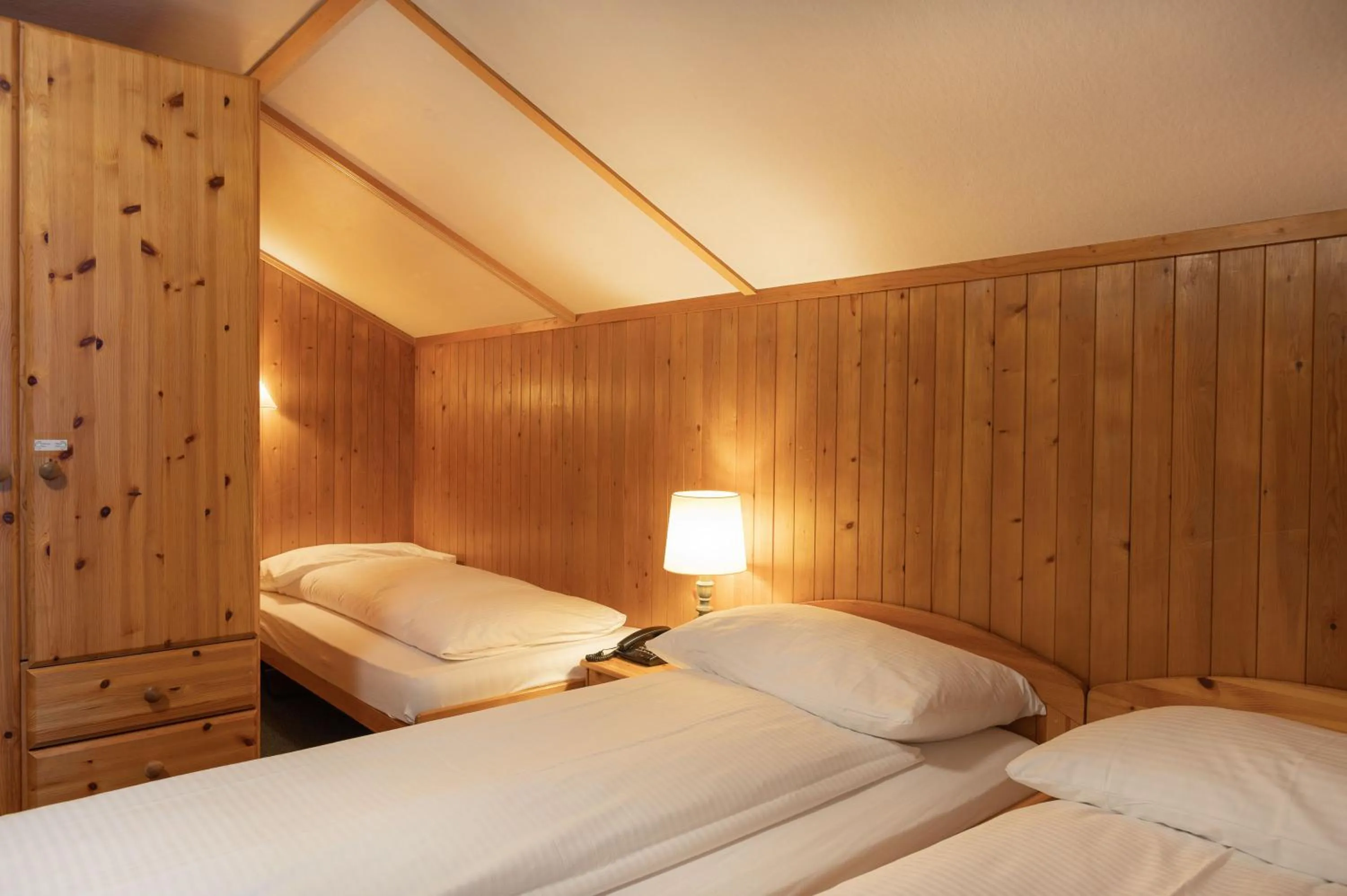 Quadruple Room with Private Bathroom in Jungfrau Lodge, Swiss Mountain Hotel