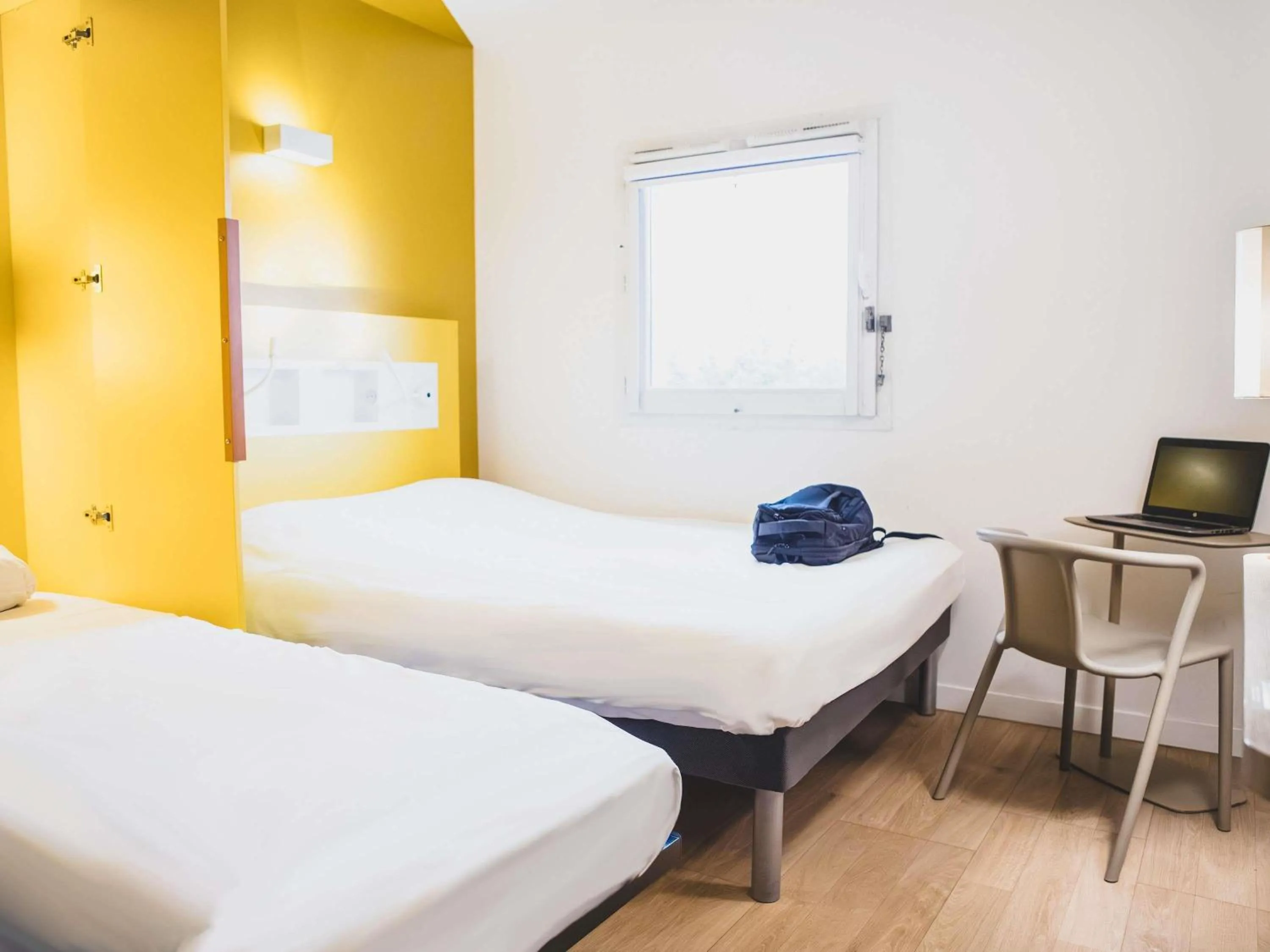 Triple Room with a Double Bed and a Single Bed in ibis budget Dijon Saint Apollinaire