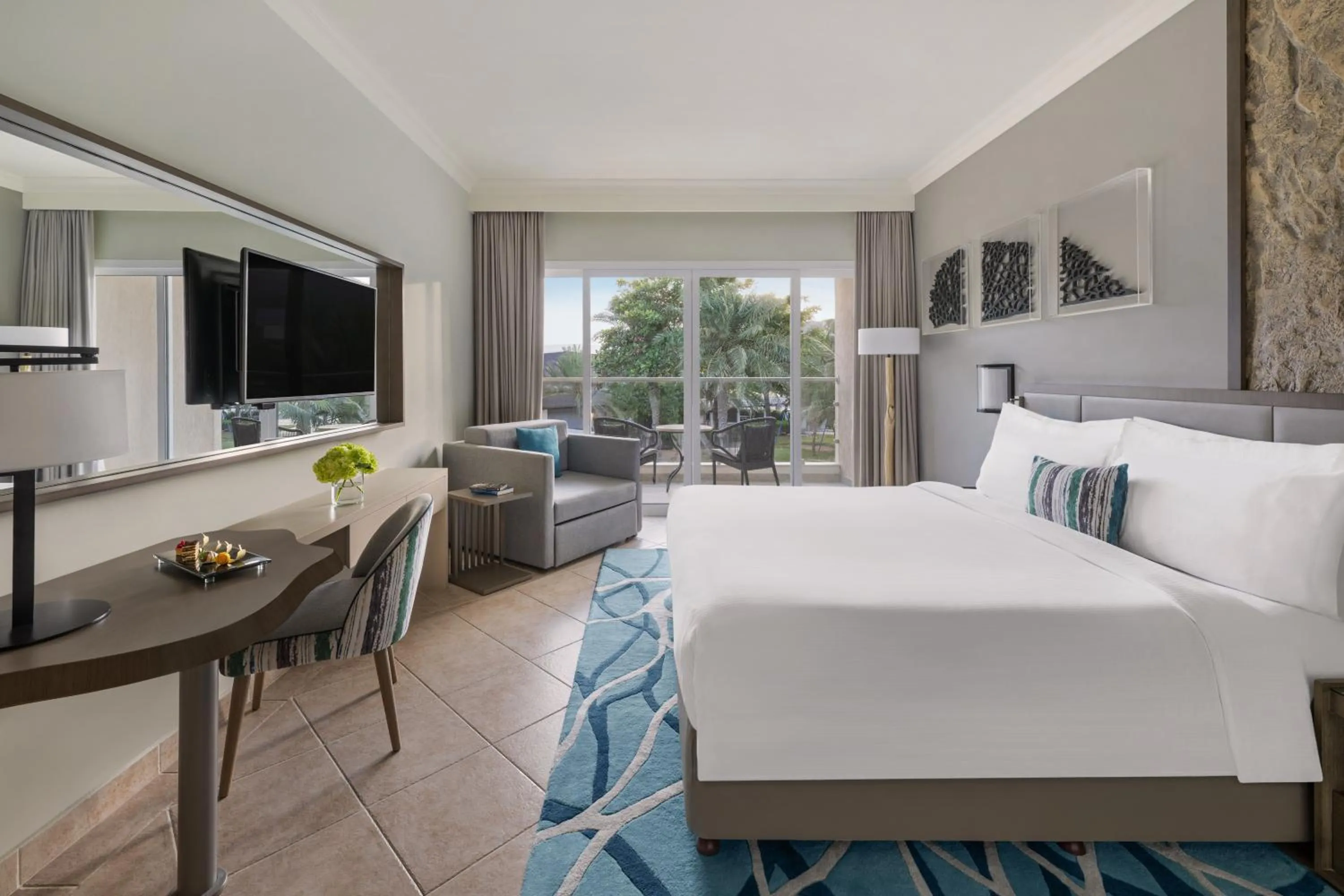 Garden View Room with Balcony - King Bed in Fujairah Rotana Resort & Spa - Al Aqah Beach