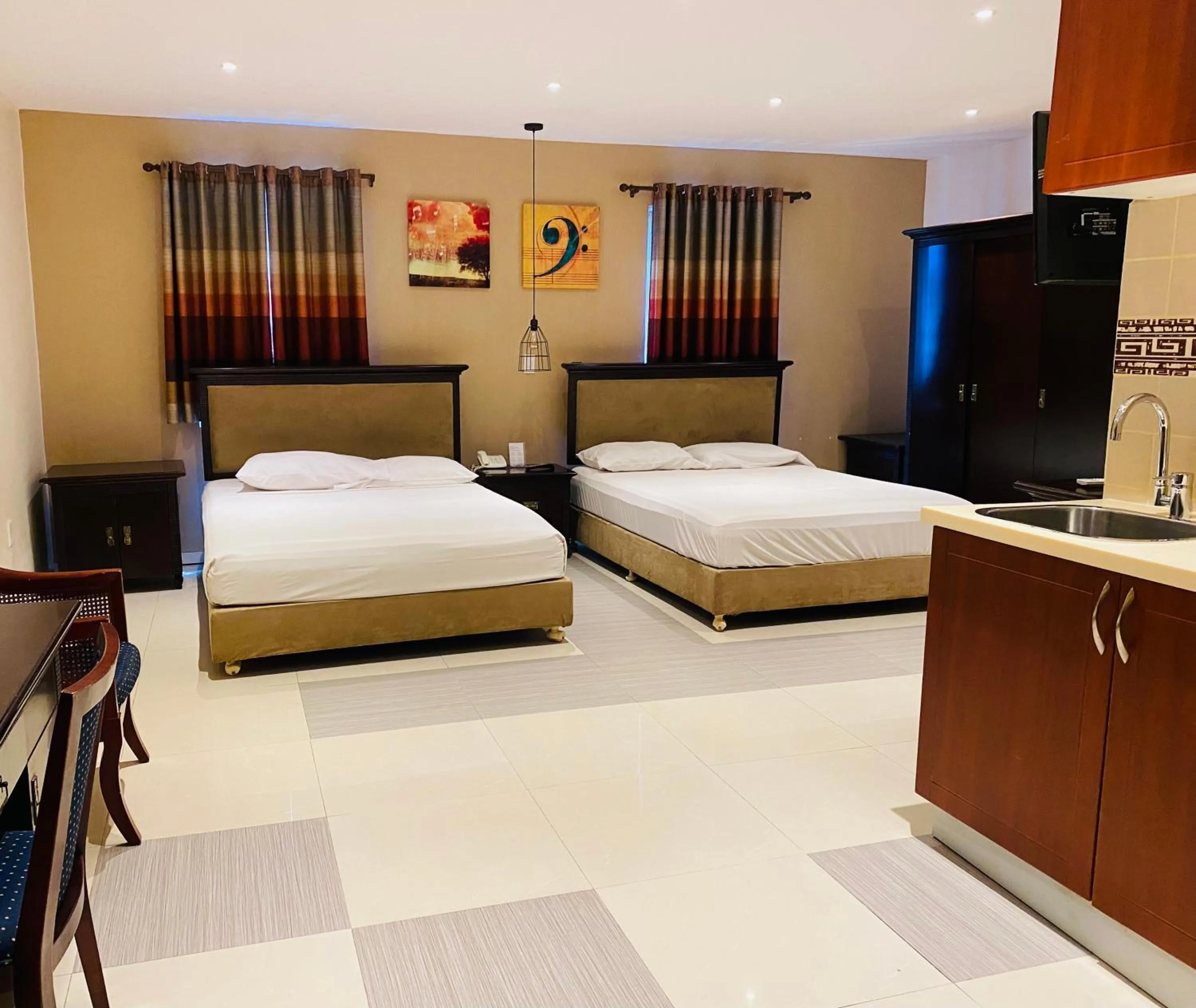 Standard Queen Room with Two Queen Beds - single occupancy in Curacao Suites Hotel