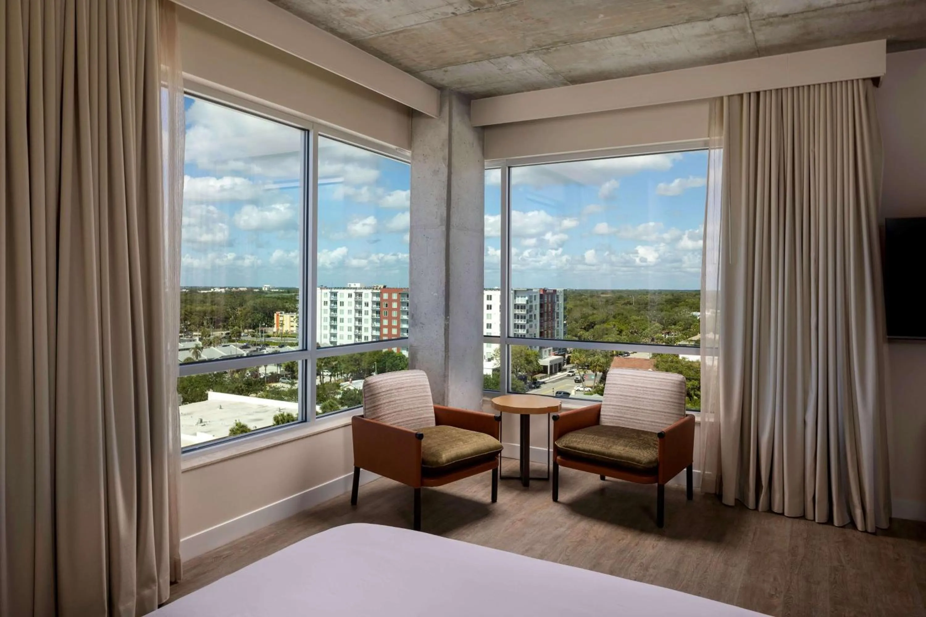 Corner King Room with Sofa and City View in Hotel Melby Downtown Melbourne Tapestry Collection By Hilton