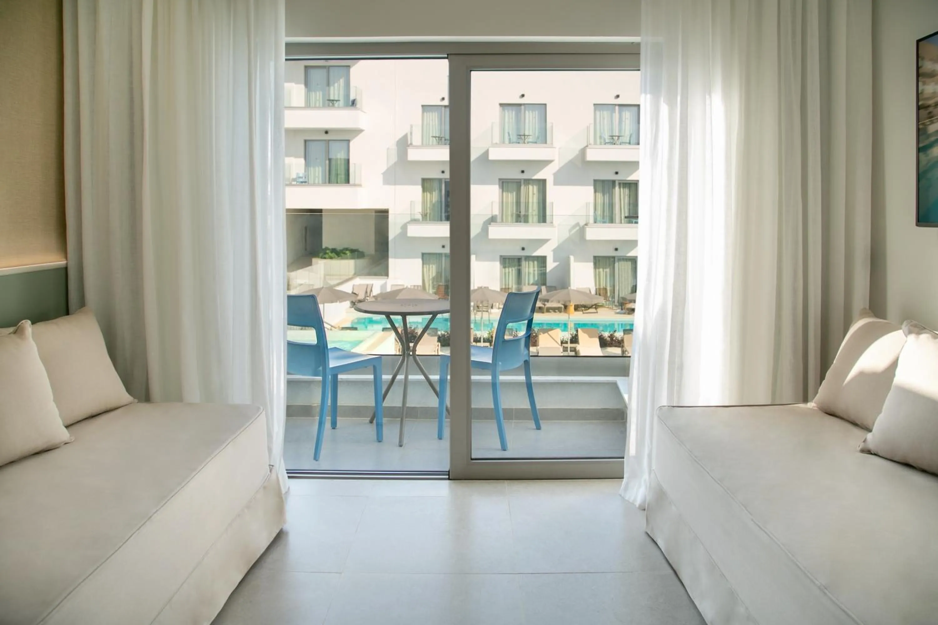 Family Room Pool View with Sliding Door in Atlantica Aqua Blue