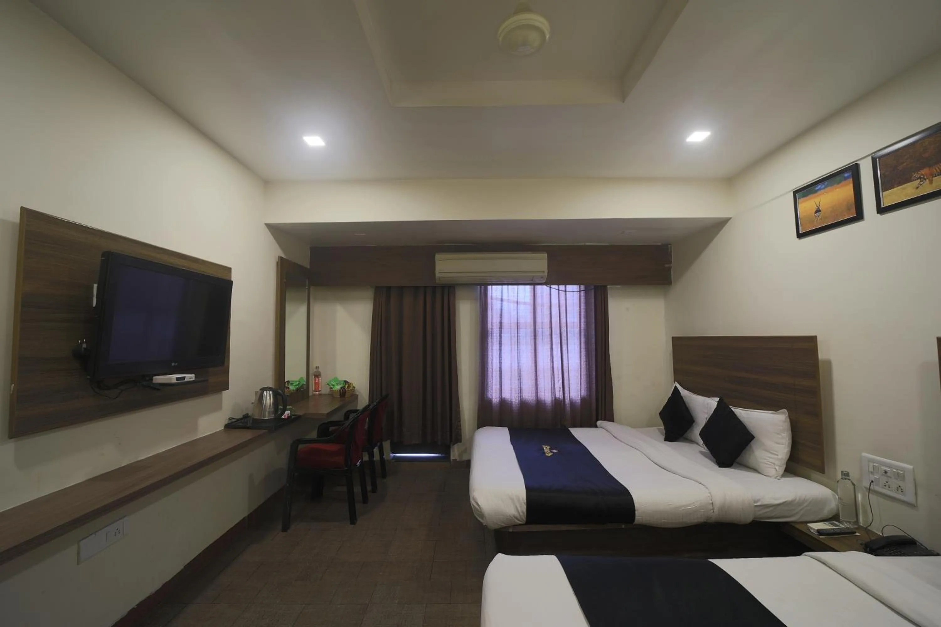 Deluxe Quadruple Room in Saish Hotel Shirdi