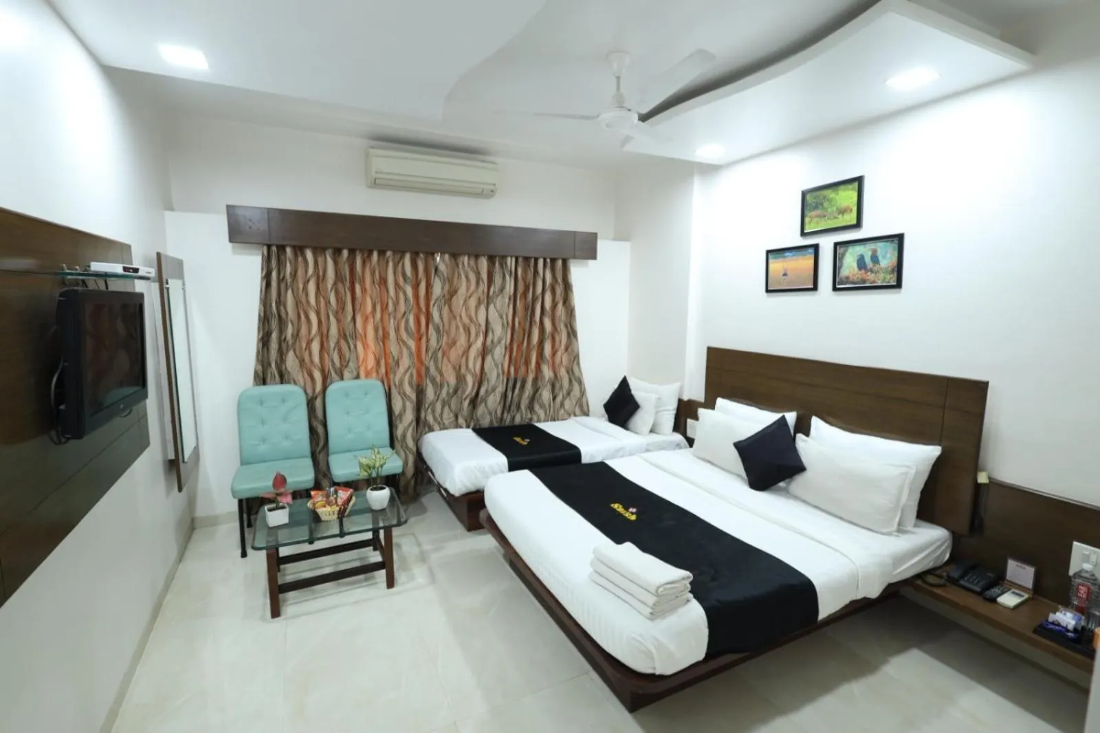 Deluxe Triple Room in Saish Hotel Shirdi