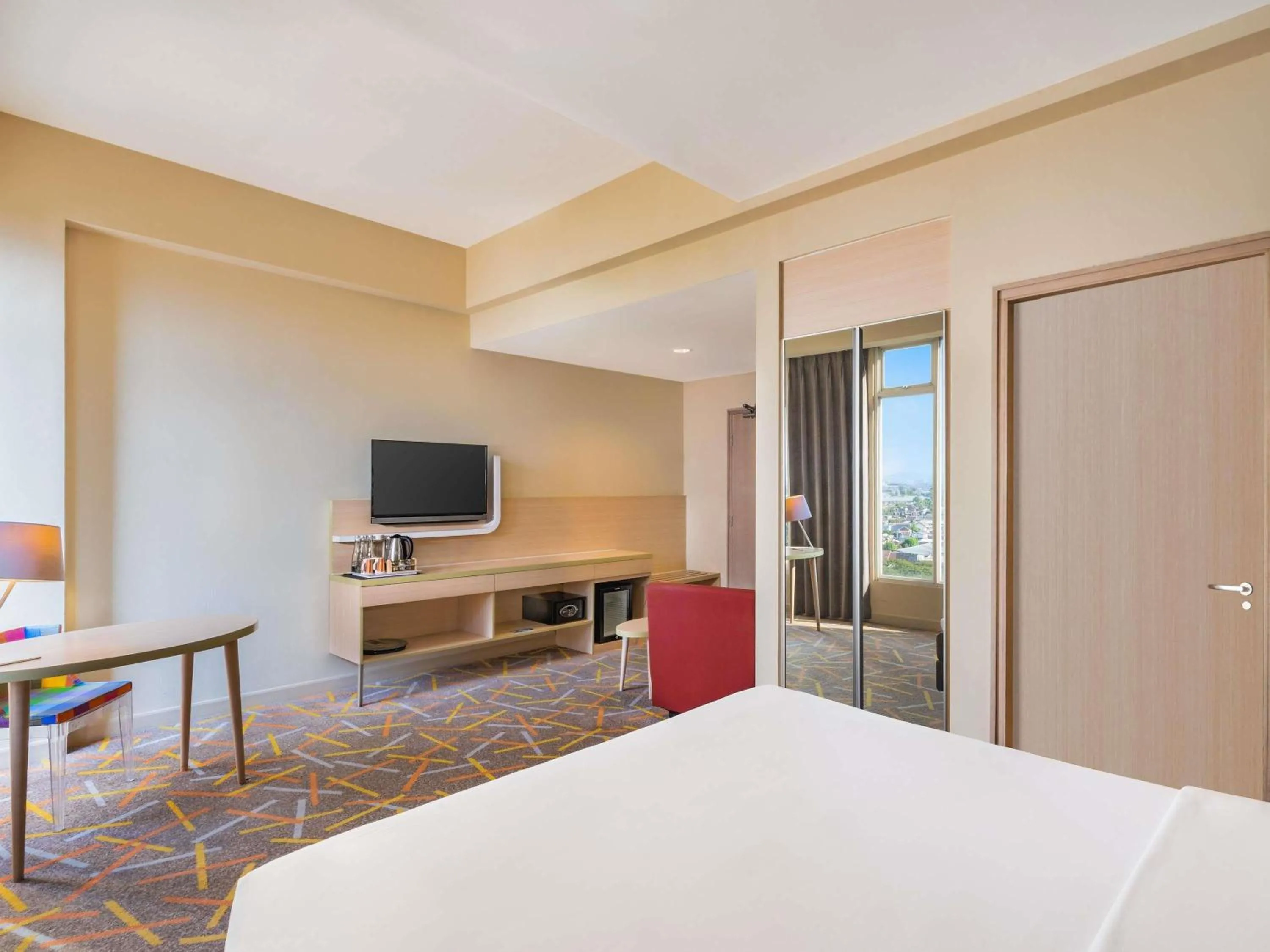 Deluxe King Room with Sofa in Ibis Styles Malang