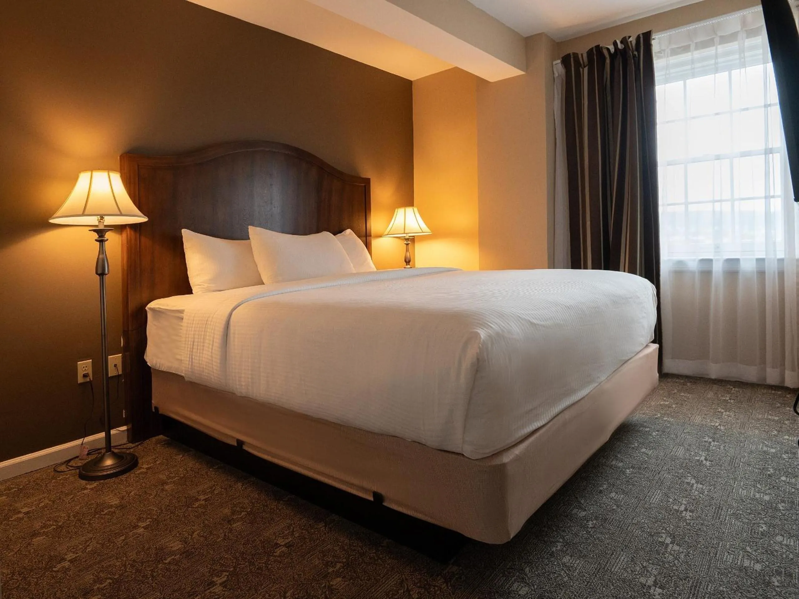 Two-Bedroom Deluxe Suite with One King Bed and One Double Bed - Non-Smoking in The Americus Hotel, Trademark Collection by Wyndham