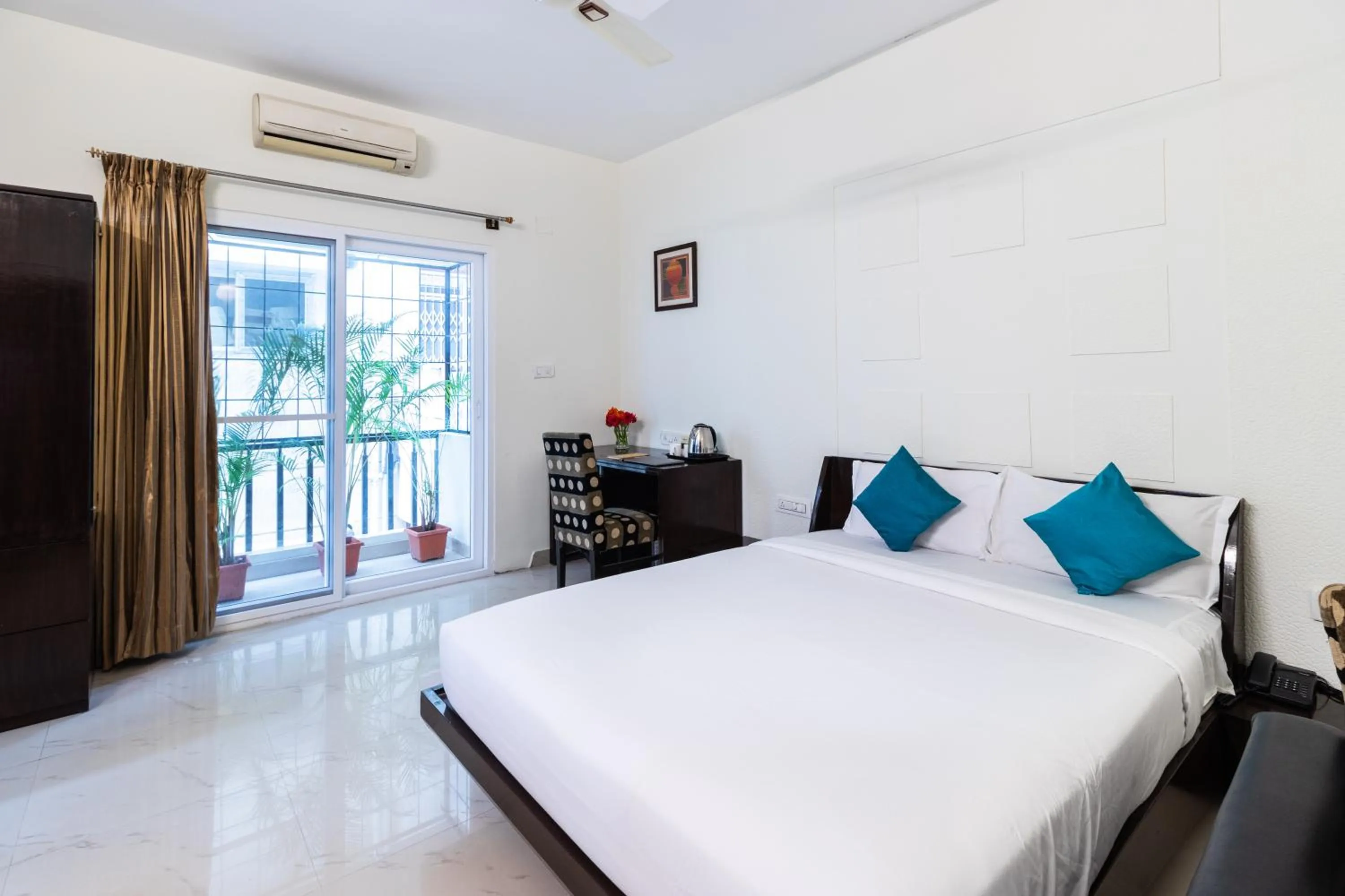 Queen Room with Balcony - single occupancy in Sanctum Suites Domlur Bangalore