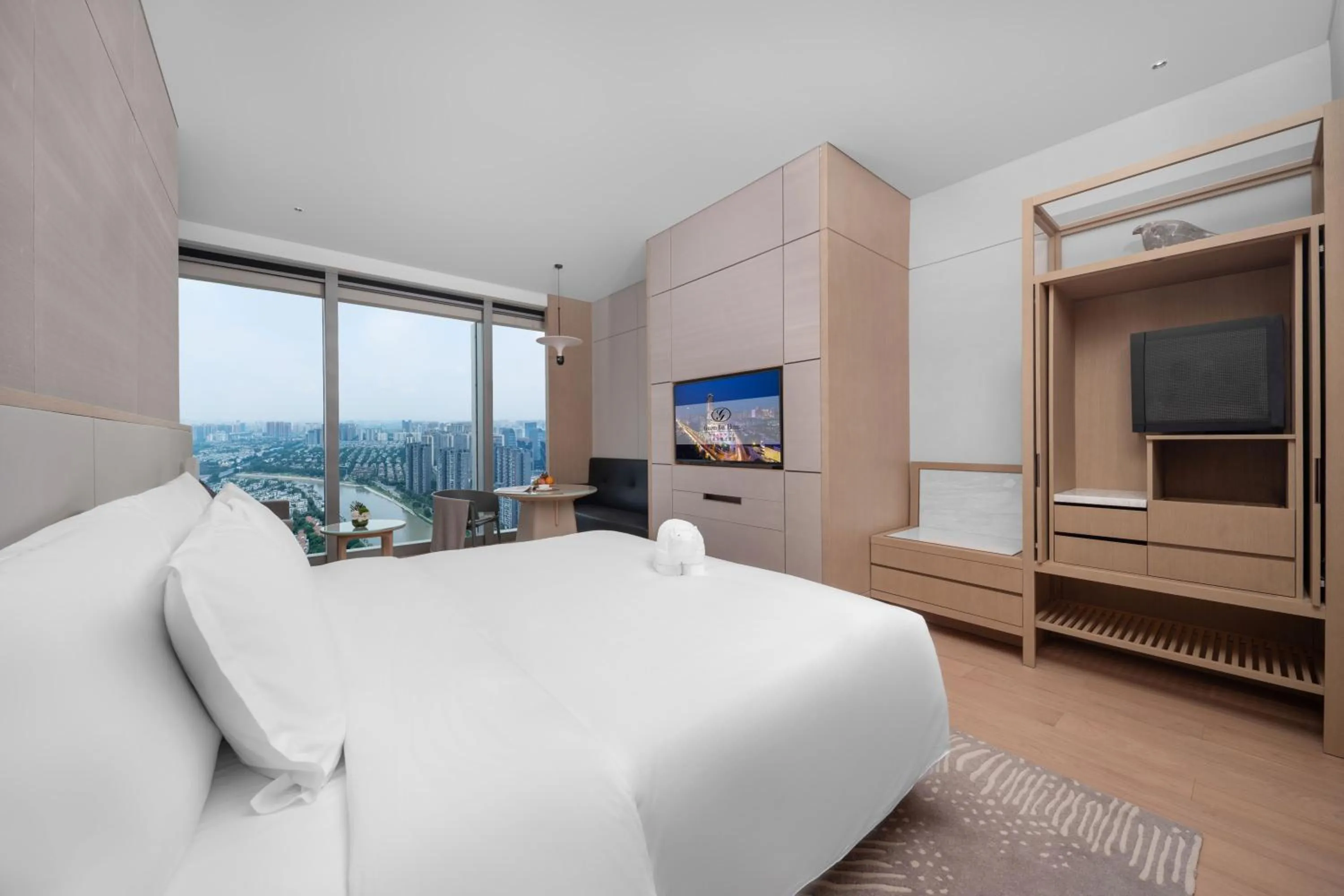 Deluxe King Room -River View  1 welcome fruit on the first day, 1 voucher for 300 RMB for Health Center, 1 voucher for playing 1000㎡children's playground, 1 single cocktail in Grand Bay Hotel Chengdu