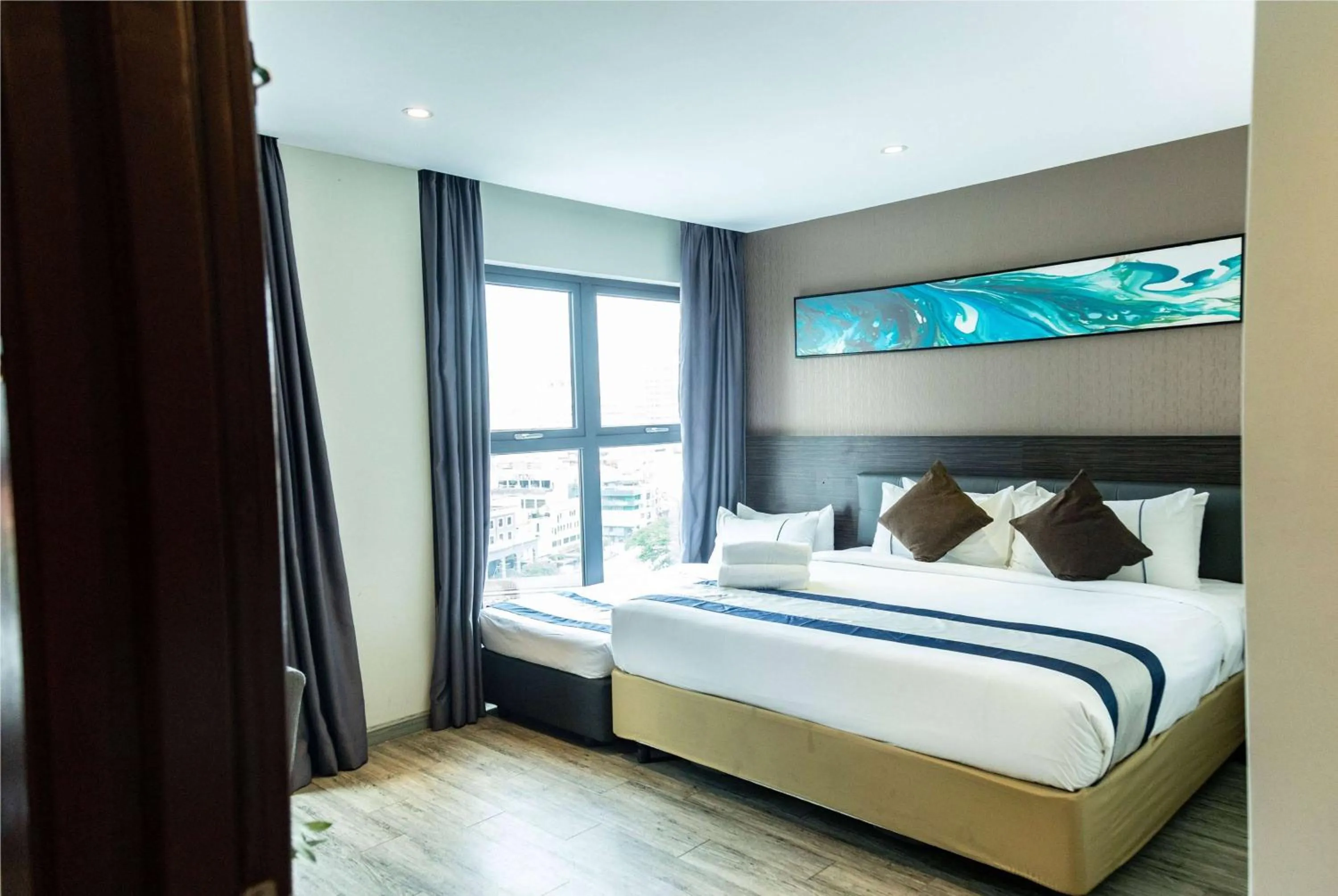 Family Triple Room with One Queen Bed and One Single Bed in Ramada Encore by Wyndham Chinatown Kuala Lumpur