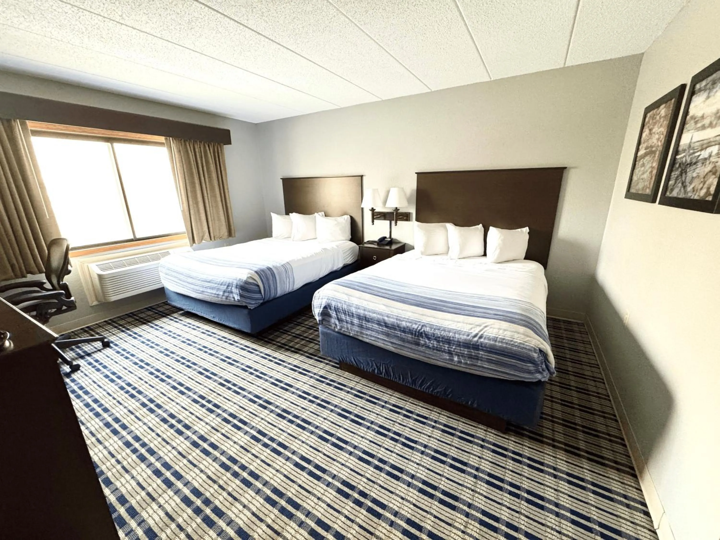 Deluxe Queen Room with Two Queen Beds - Non-Smoking in AmericInn by Wyndham Ames