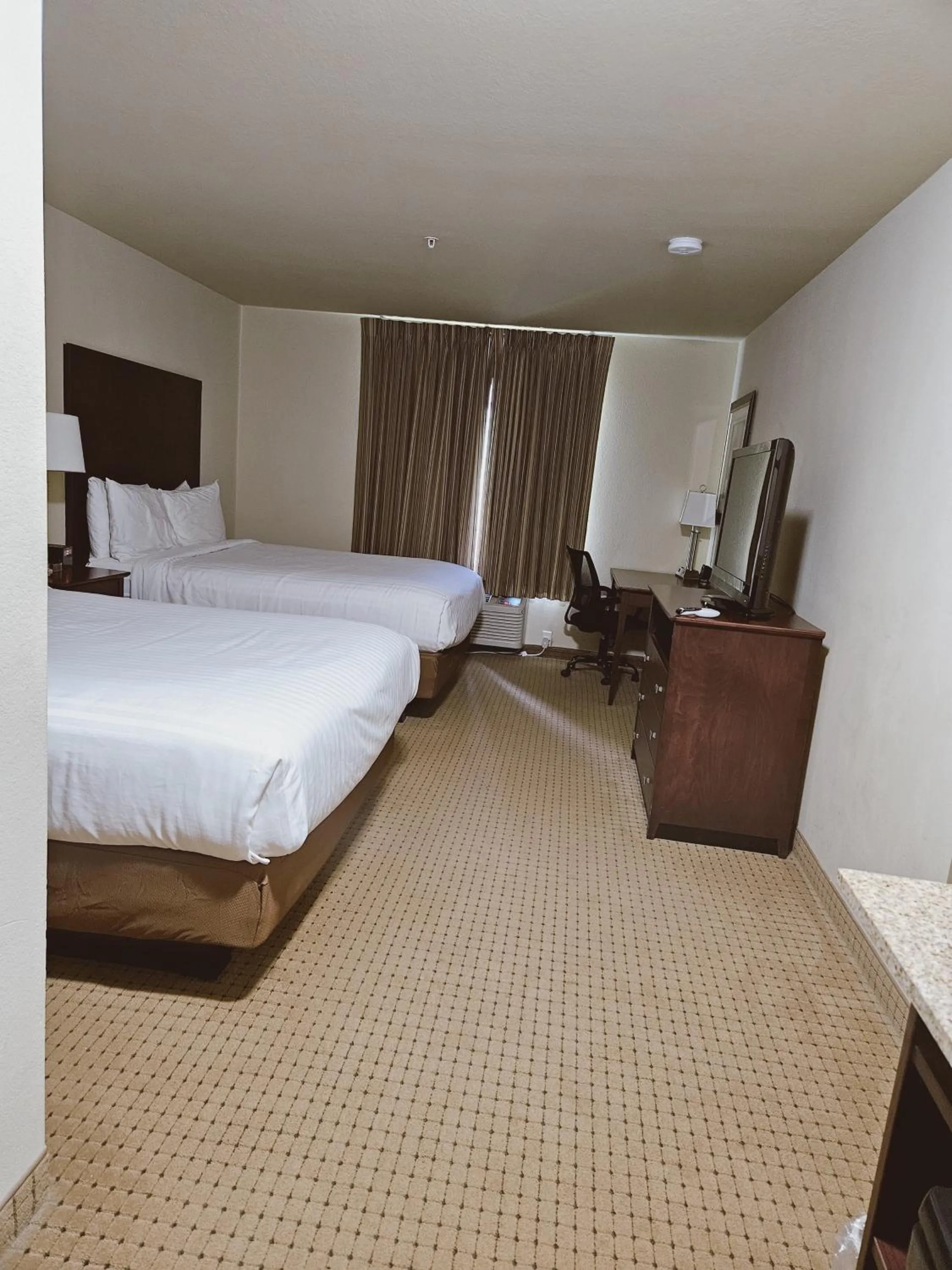 Queen Room with Two Queen Beds in Cobblestone Inn & Suites - Bloomfield