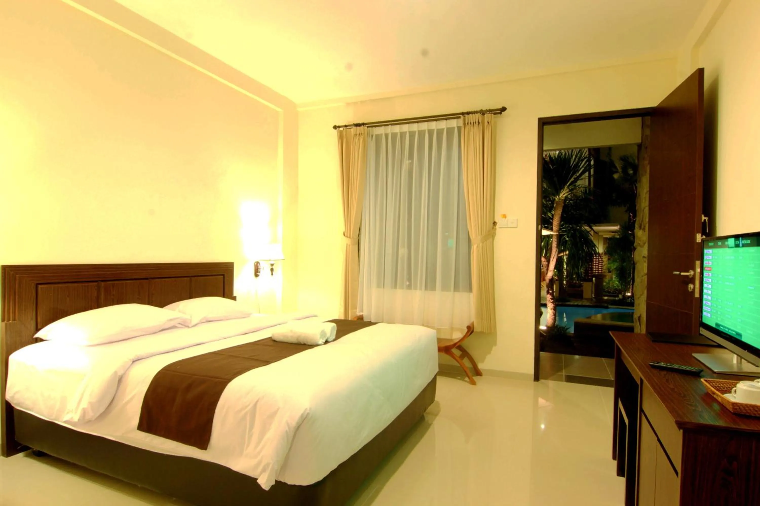Deluxe Double or Twin Room with Pool View with Free One Way Airport Transfer in Manggar Indonesia Hotel