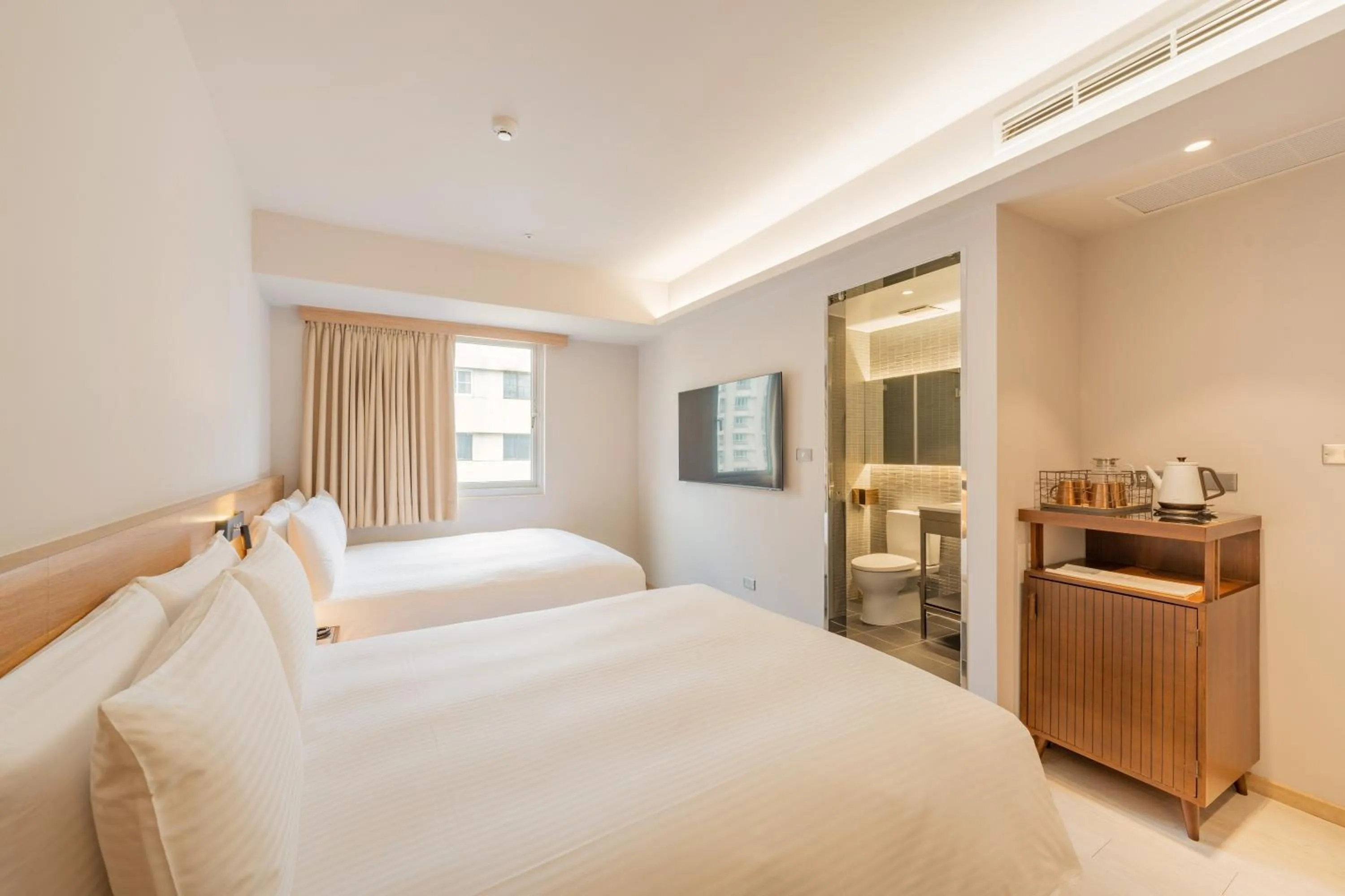 Standard Quadruple Room in Inns Hotel