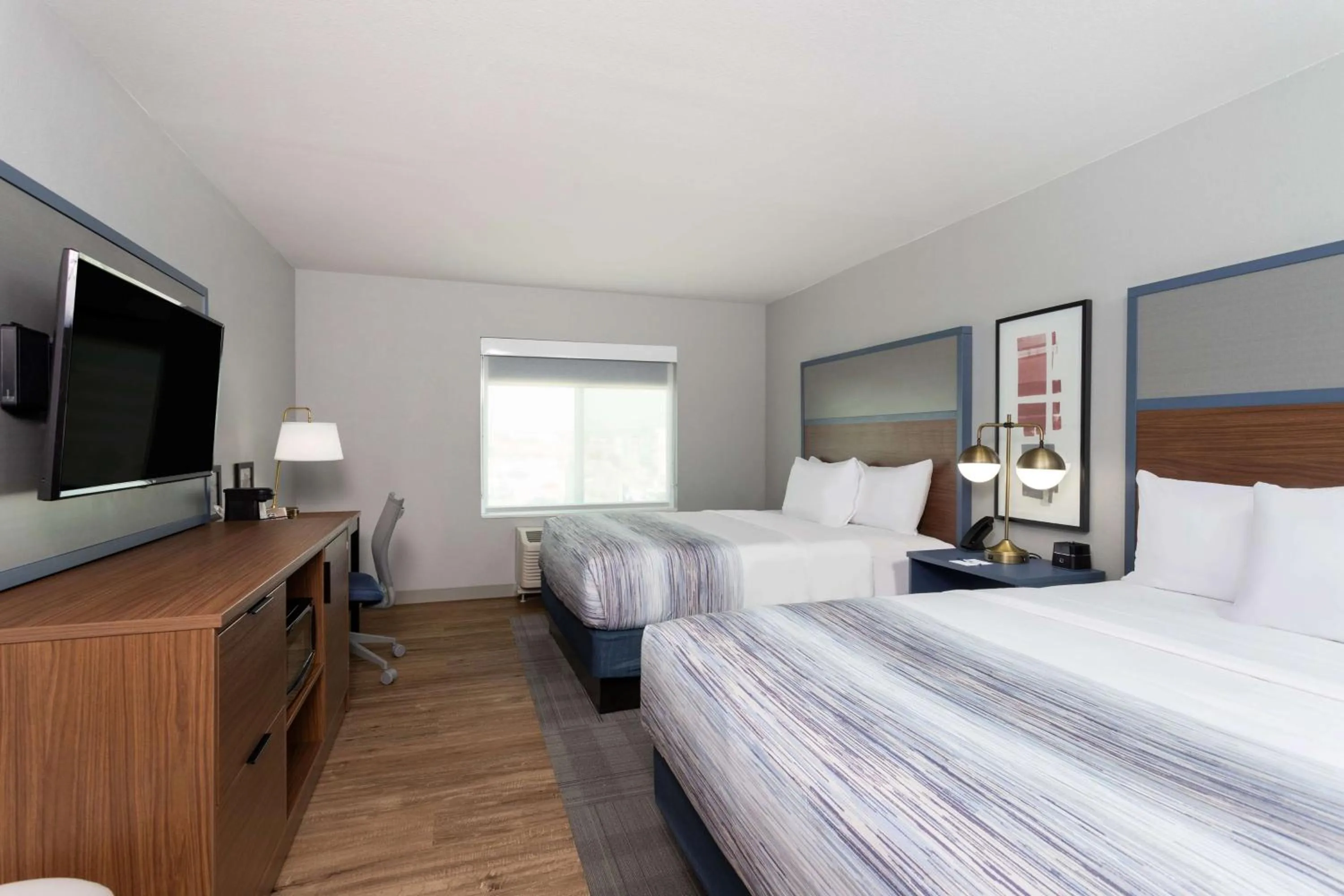 Queen Room with Two Queen Beds - Non-Smoking in AmericInn by Wyndham San Angelo